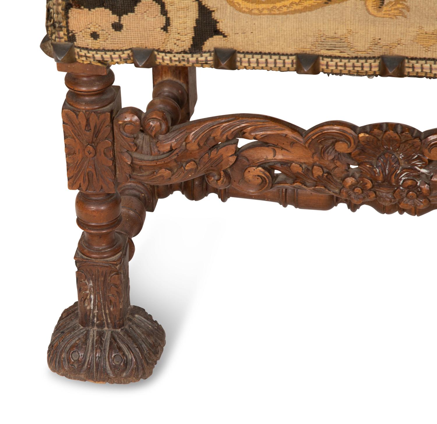 A Pair of English Baroque Style Carved Walnut Armchairs with Needlepoint Upholstery