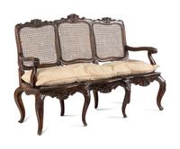 An Italian Rococo Style Carved Walnut Settee