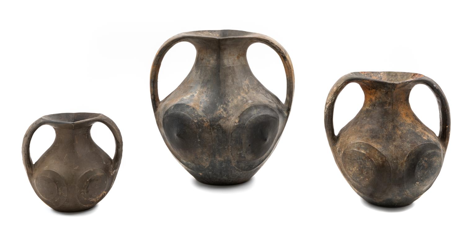 A Group of Sichuan Burnished Black Pottery Jars Height of tallest 13 1/4 inches. — HAN DYNASTY (206 B.C.E.-220 C.E.)