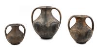 A Group of Sichuan Burnished Black Pottery Jars Height of tallest 13 1/4 inches. — HAN DYNASTY (206 B.C.E.-220 C.E.)