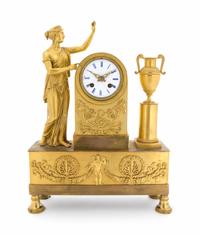 An Empire Gilt Bronze Figural Mantel Clock Height 16 3/8 x width 11 7/8 inches. — CIRCA 1810