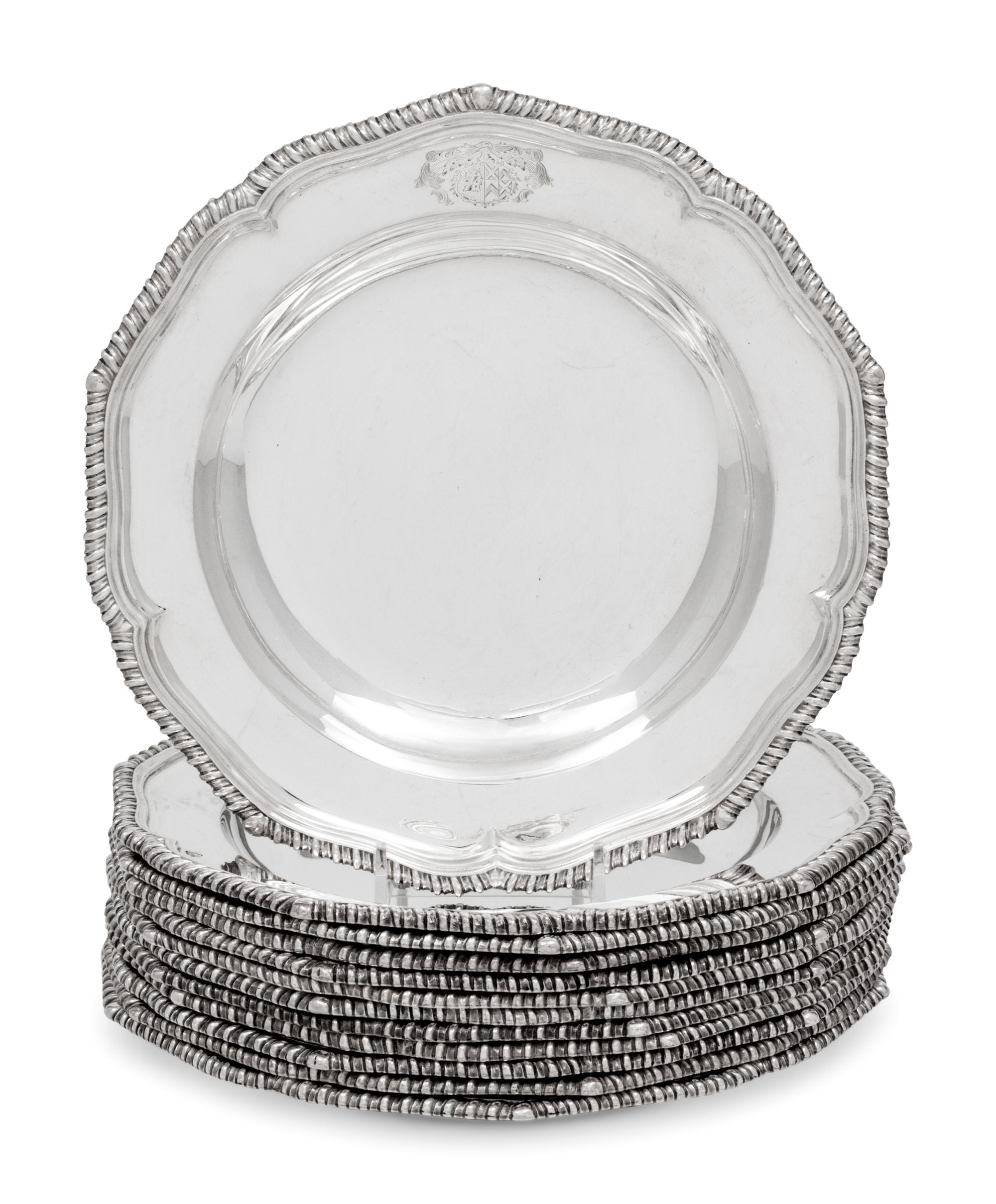 A Set of Twelve Silver Armorial Soup Plates