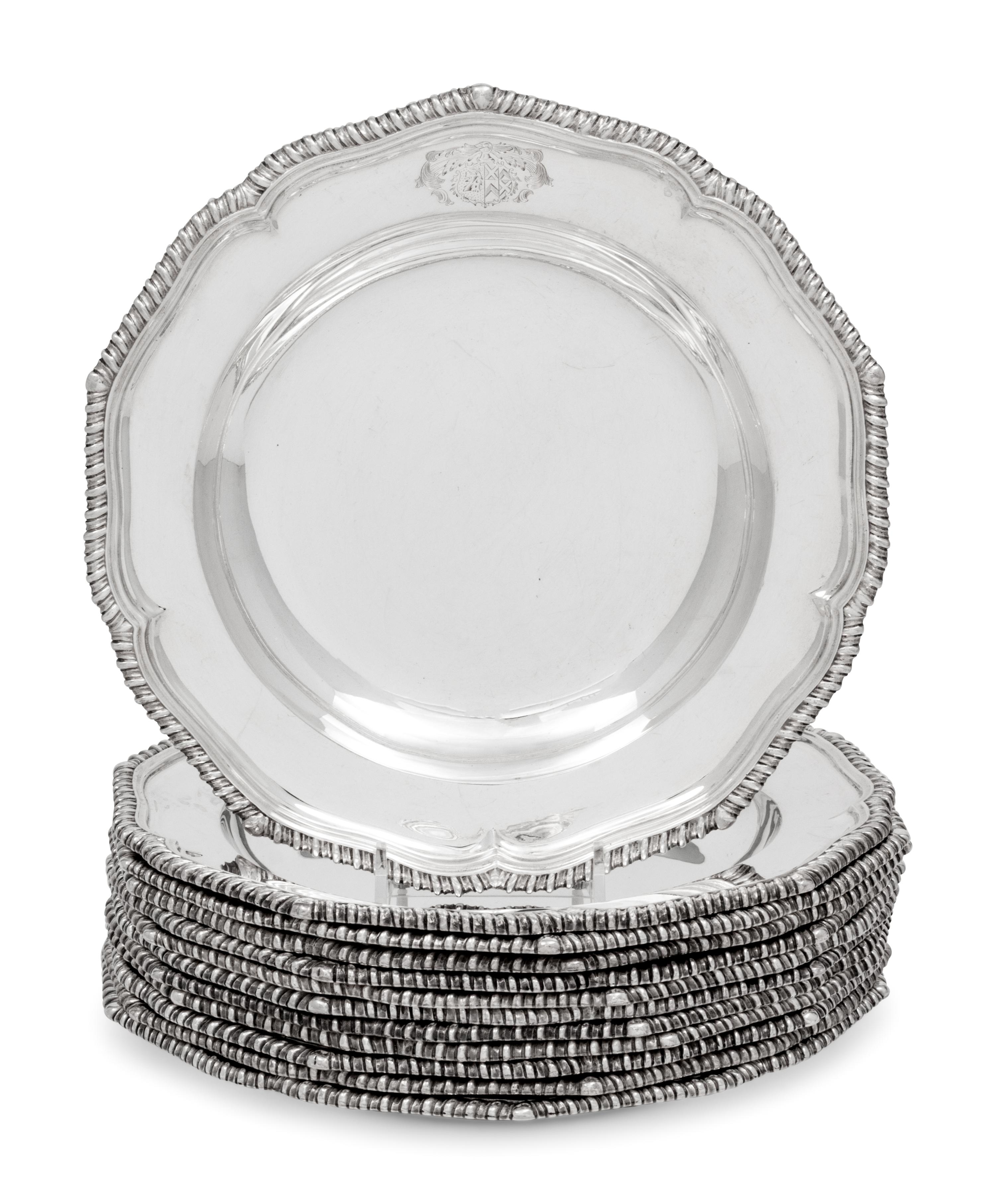 A Set of Twelve Silver Armorial Soup Plates