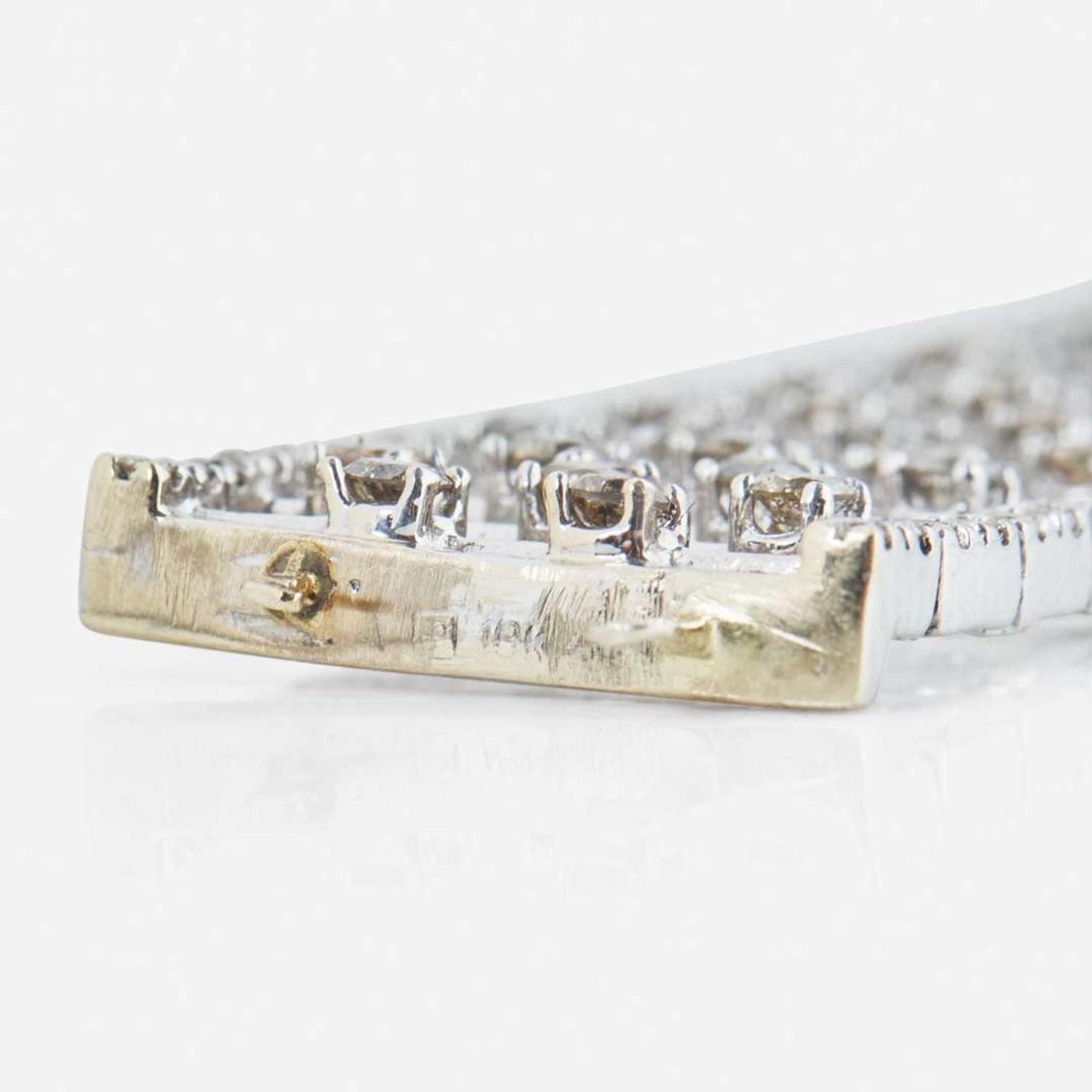 An 18K White Gold, Diamond, and Colored Diamond Bracelet