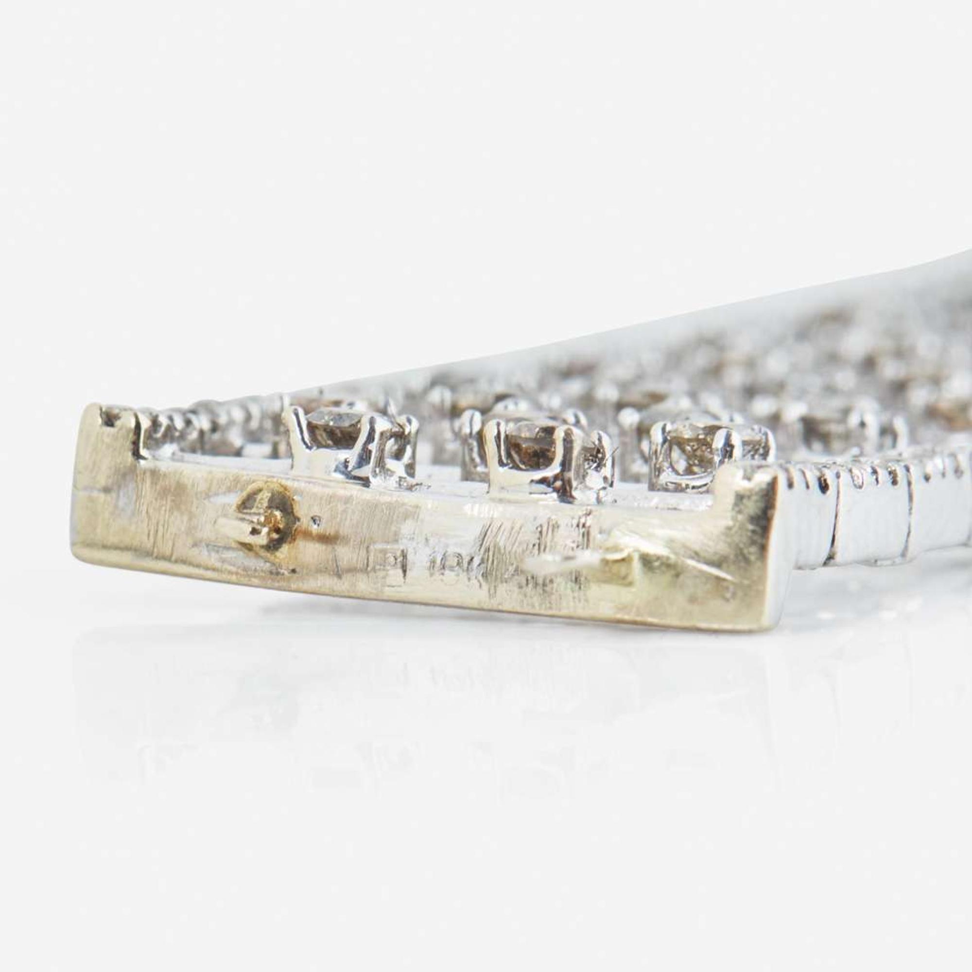 An 18K White Gold, Diamond, and Colored Diamond Bracelet
