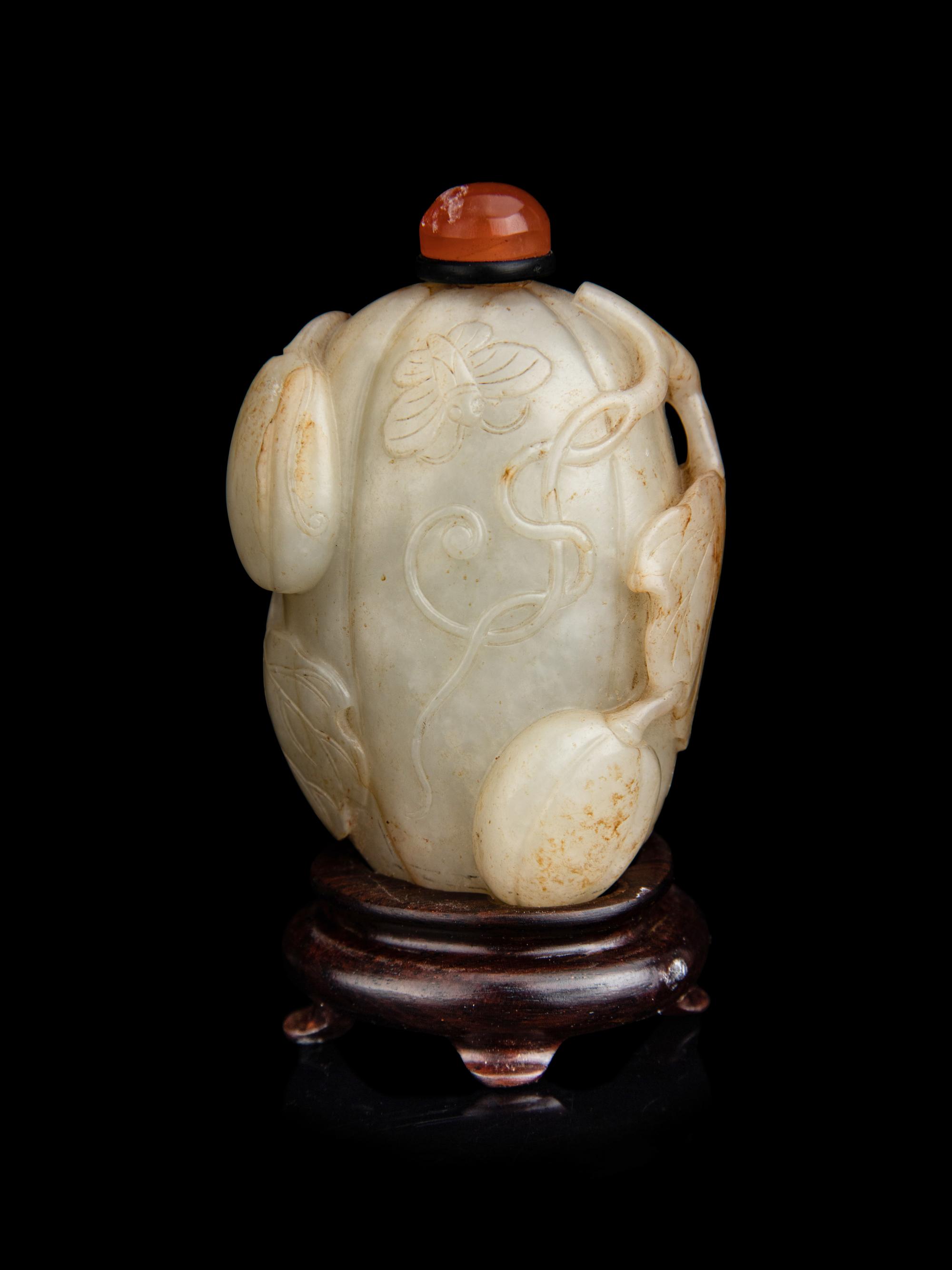 A Chinese White and Russet Jade Melon-Form Snuff Bottle