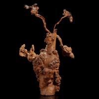 A burl wood vase of "Flowers"