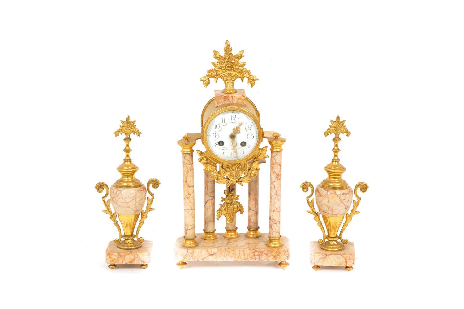 A French Gilt Bronze and Rouge Marble Clock Garniture