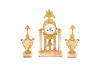 A French Gilt Bronze and Rouge Marble Clock Garniture