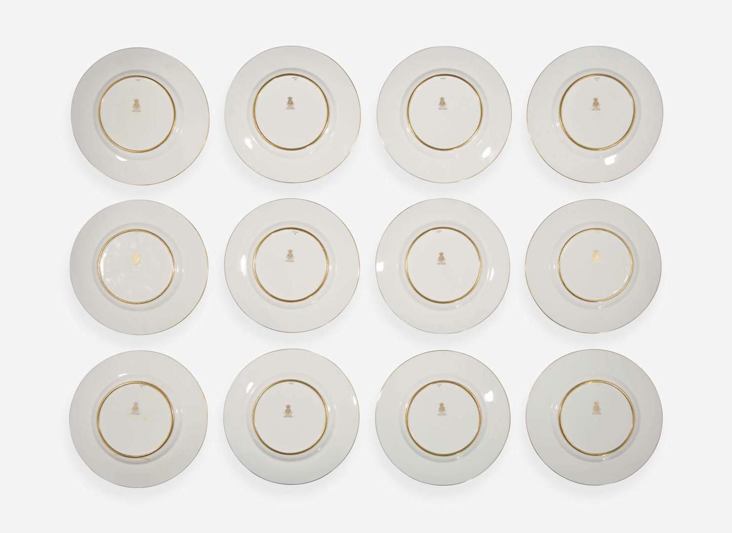 A set of twelve pate-sur-pate gilt and enameled porcelain luncheon plates, Minton, England, retailed by Tiffany & Co., New York, NY, date marks for 1928-1929