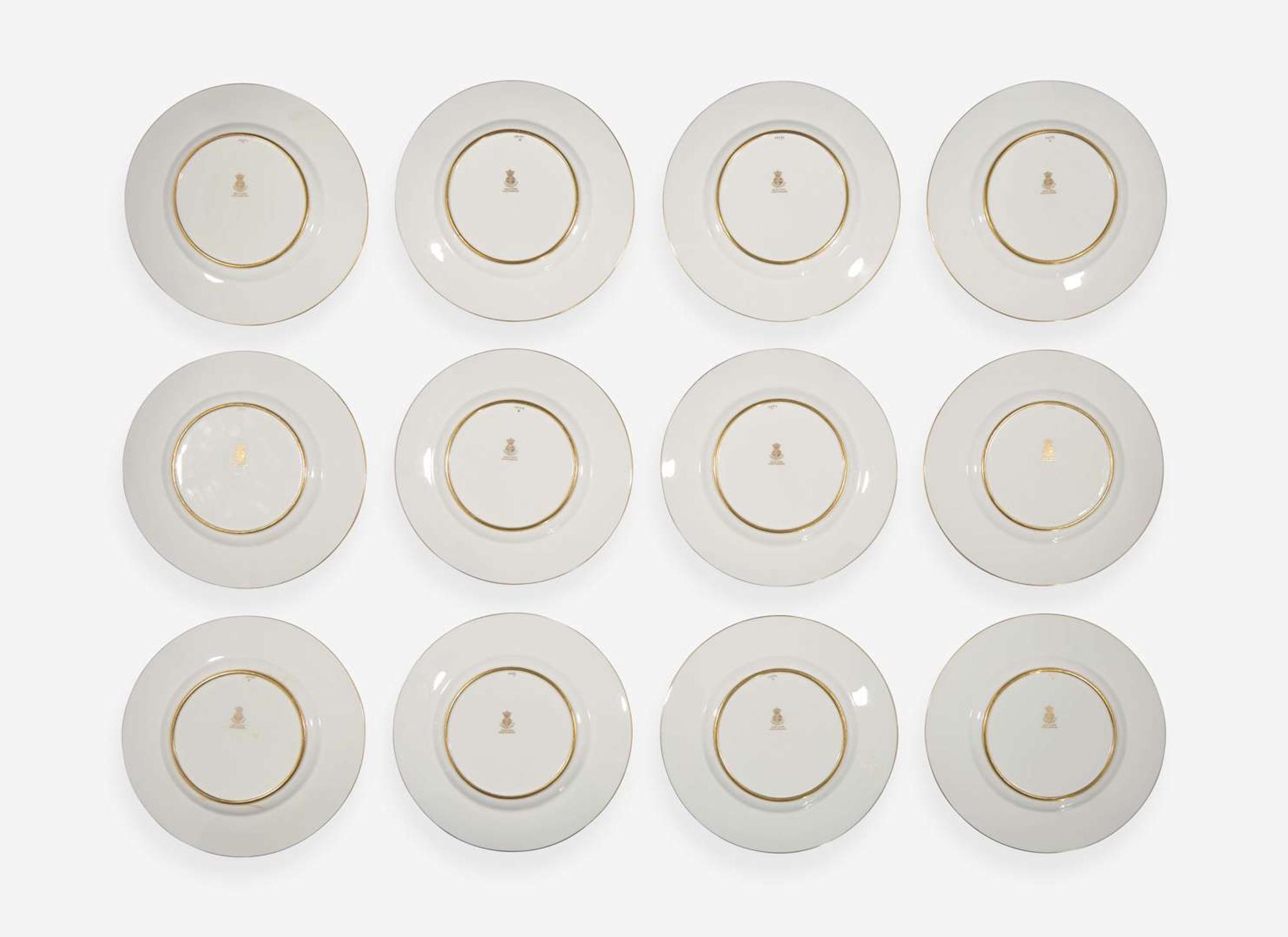 A set of twelve pate-sur-pate gilt and enameled porcelain luncheon plates, Minton, England, retailed by Tiffany & Co., New York, NY, date marks for 1928-1929