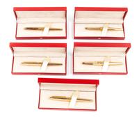 A Group of Five S.T. Dupont Gold-Plated Ellipsis Fountain Pens
