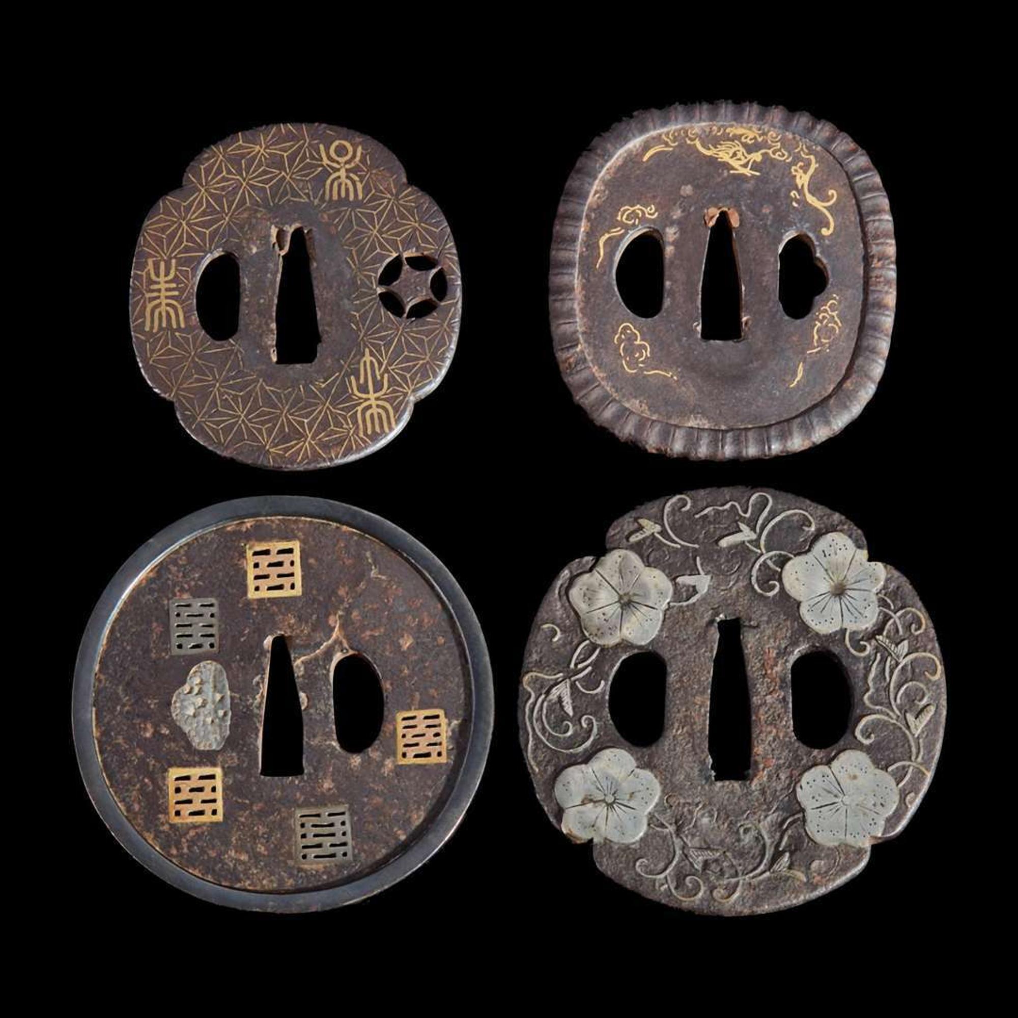 Group of eight assorted Japanese tsuba Meiji period and earlier