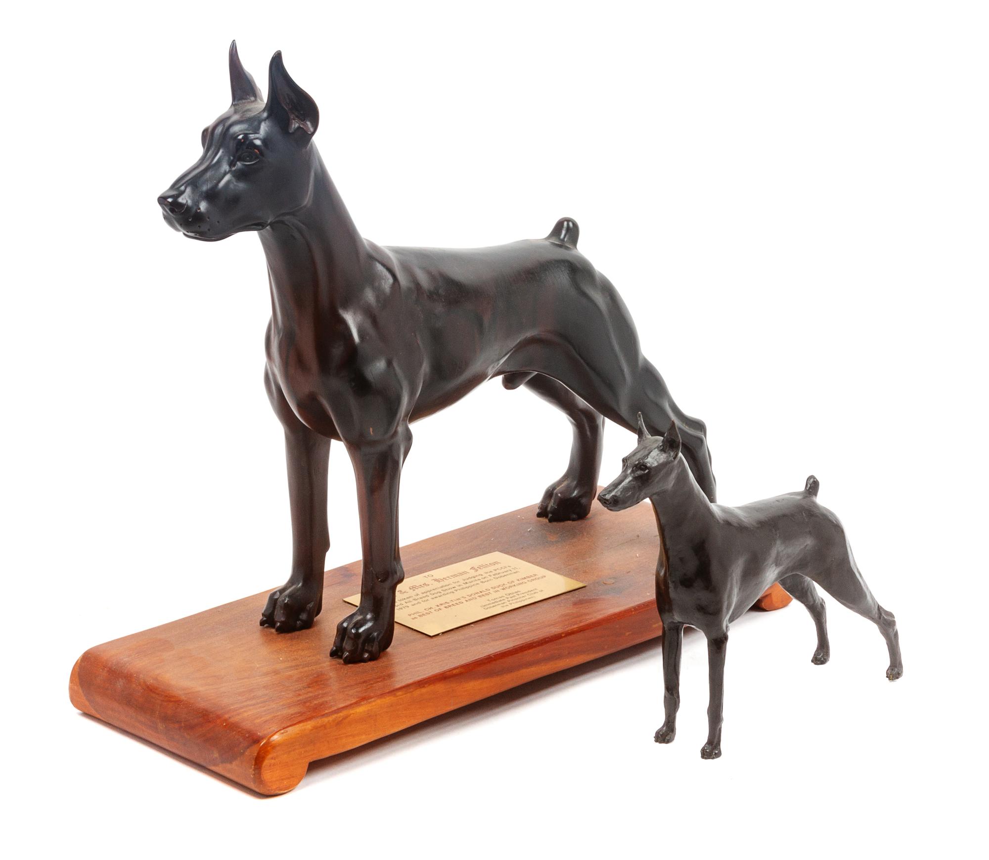 Two Doberman Figures Height of taller 15 1/4 inches.
