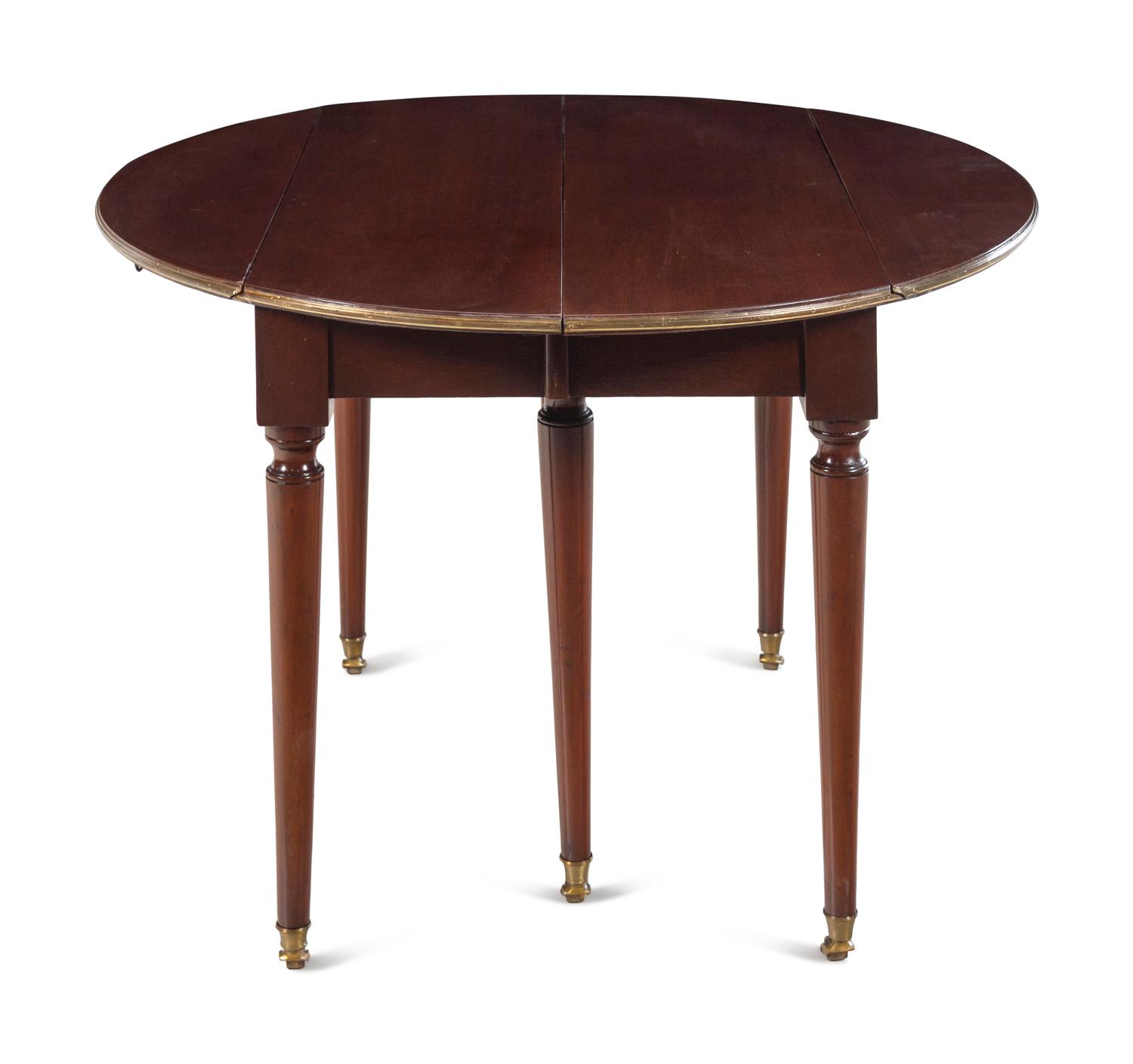 A French Brass Mounted Mahogany Drop-Leaf Dining Table