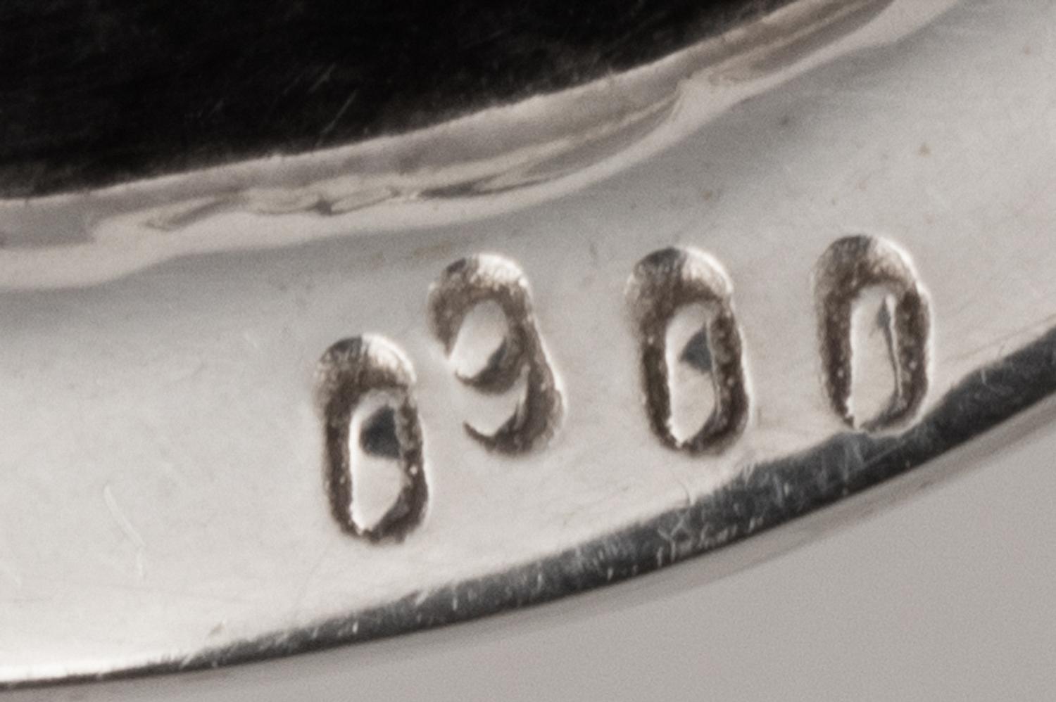 A Set of Nine Silver Bread Plates