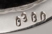 A Set of Nine Silver Bread Plates