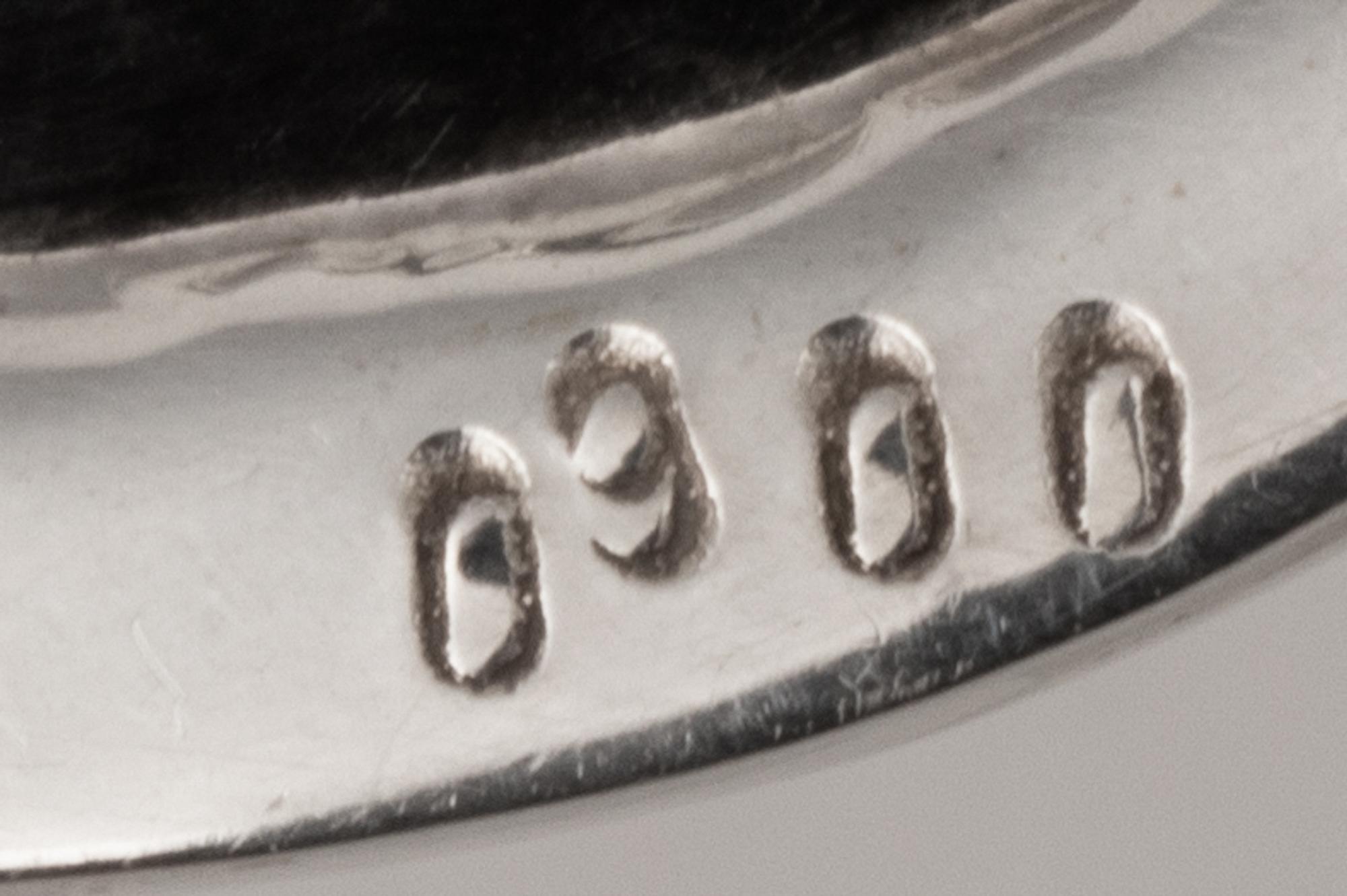 A Set of Nine Silver Bread Plates