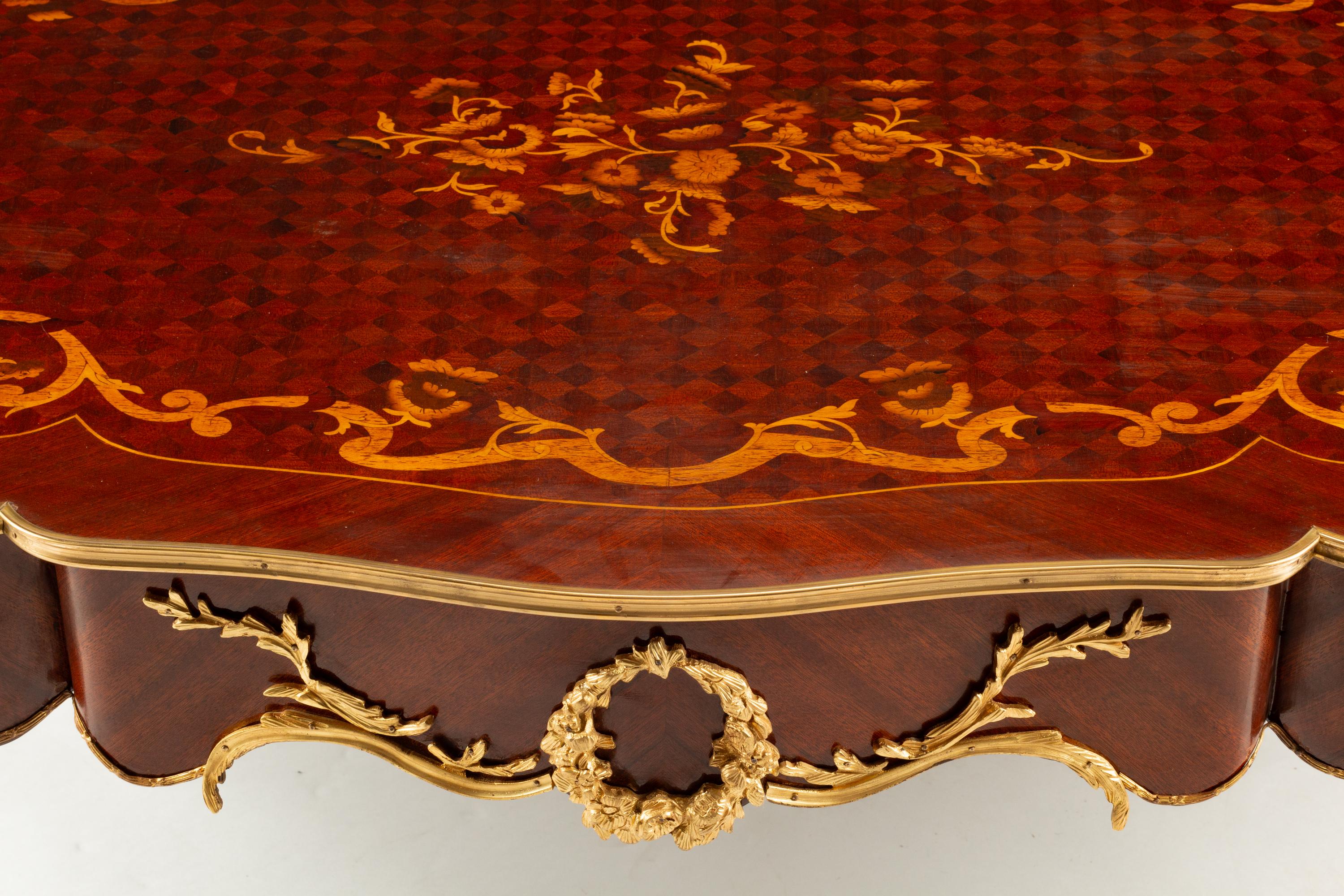 A Louis XV Style Gilt Bronze Mounted Marquetry Low Table