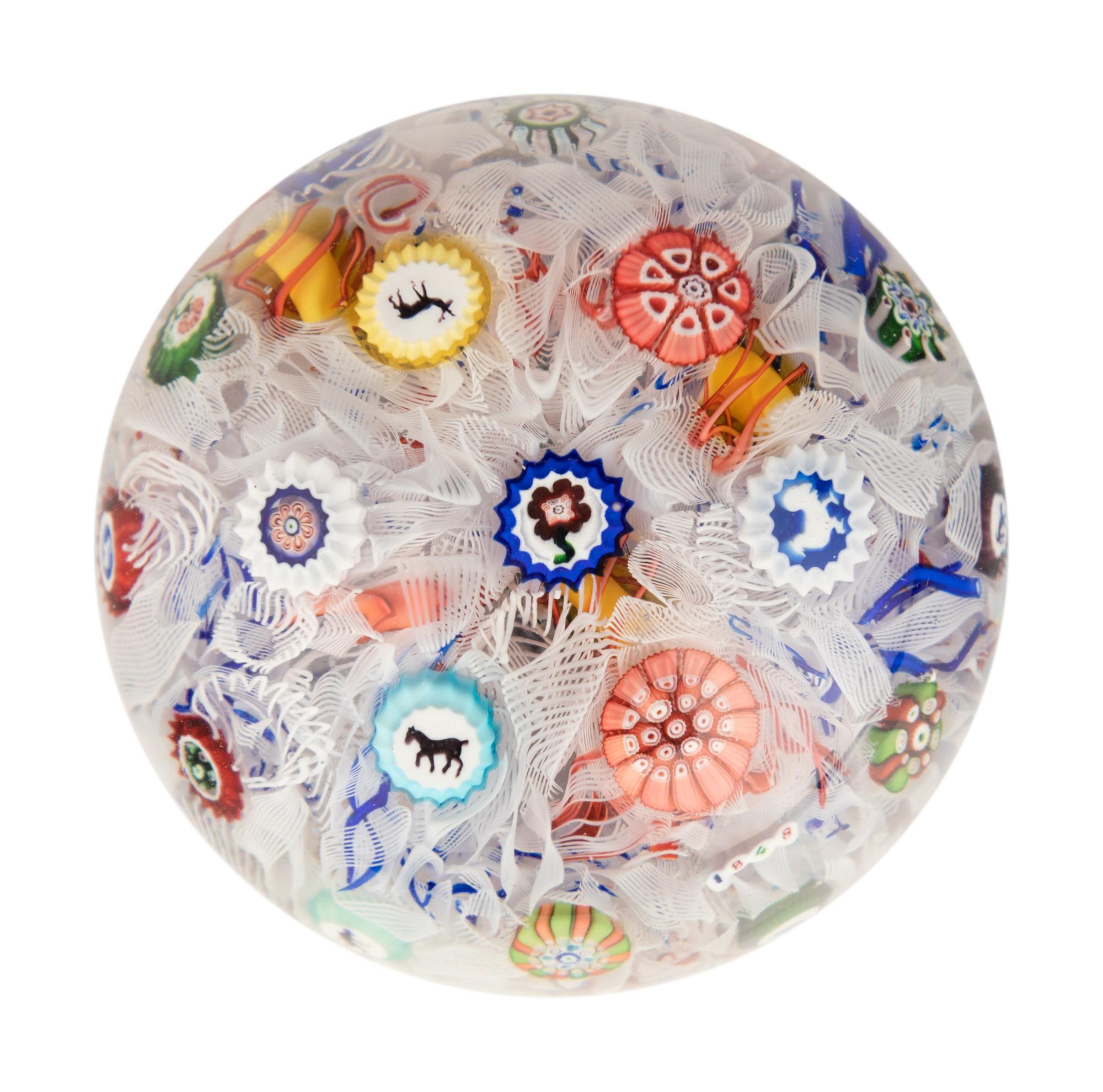 A Baccarat Spaced Concentric Millefiori and Gridel Silhouettes on Upset Muslin Glass Paperweight