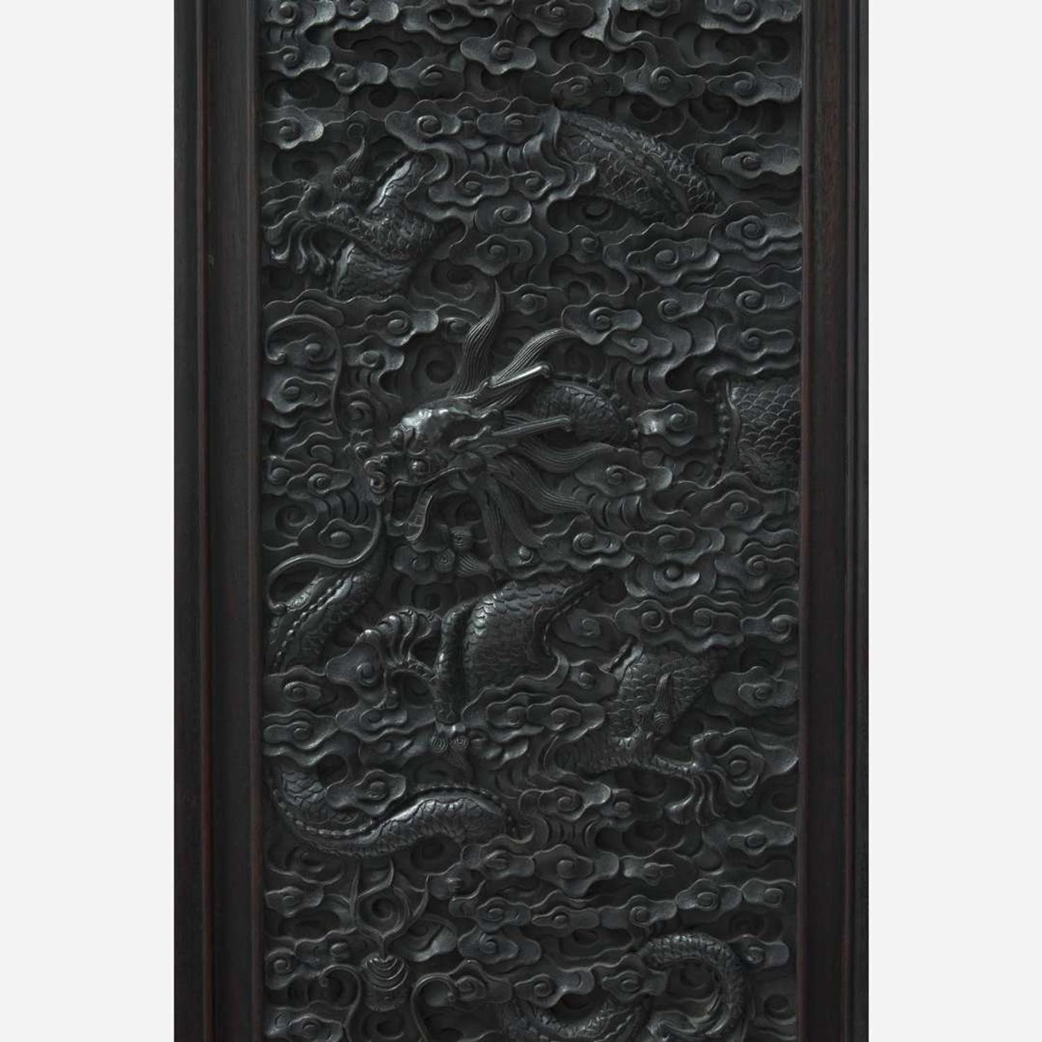 A Chinese carved hardwood six-panel “Dragons” screen 硬木浮雕龙纹六开屏风