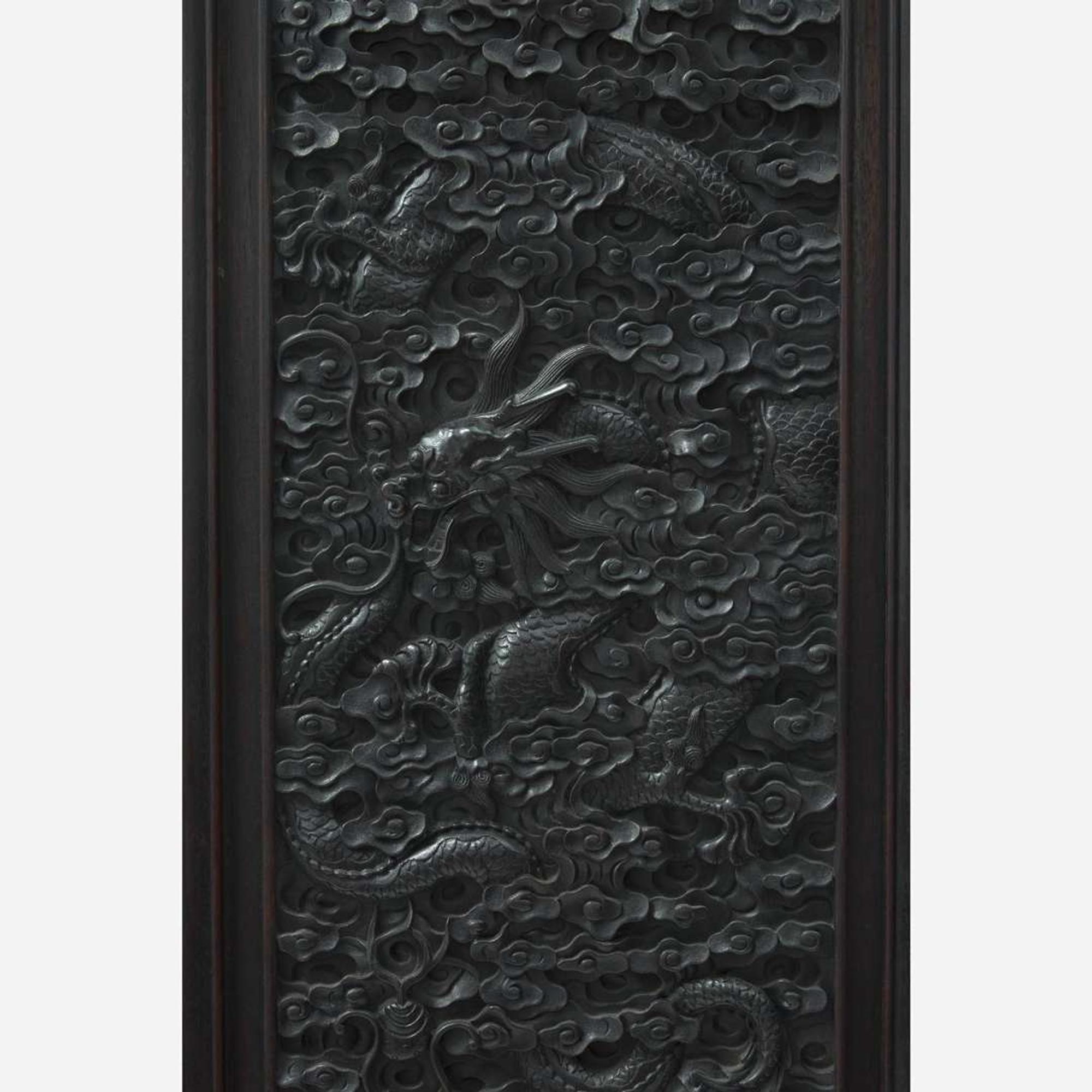 A Chinese carved hardwood six-panel “Dragons” screen 硬木浮雕龙纹六开屏风