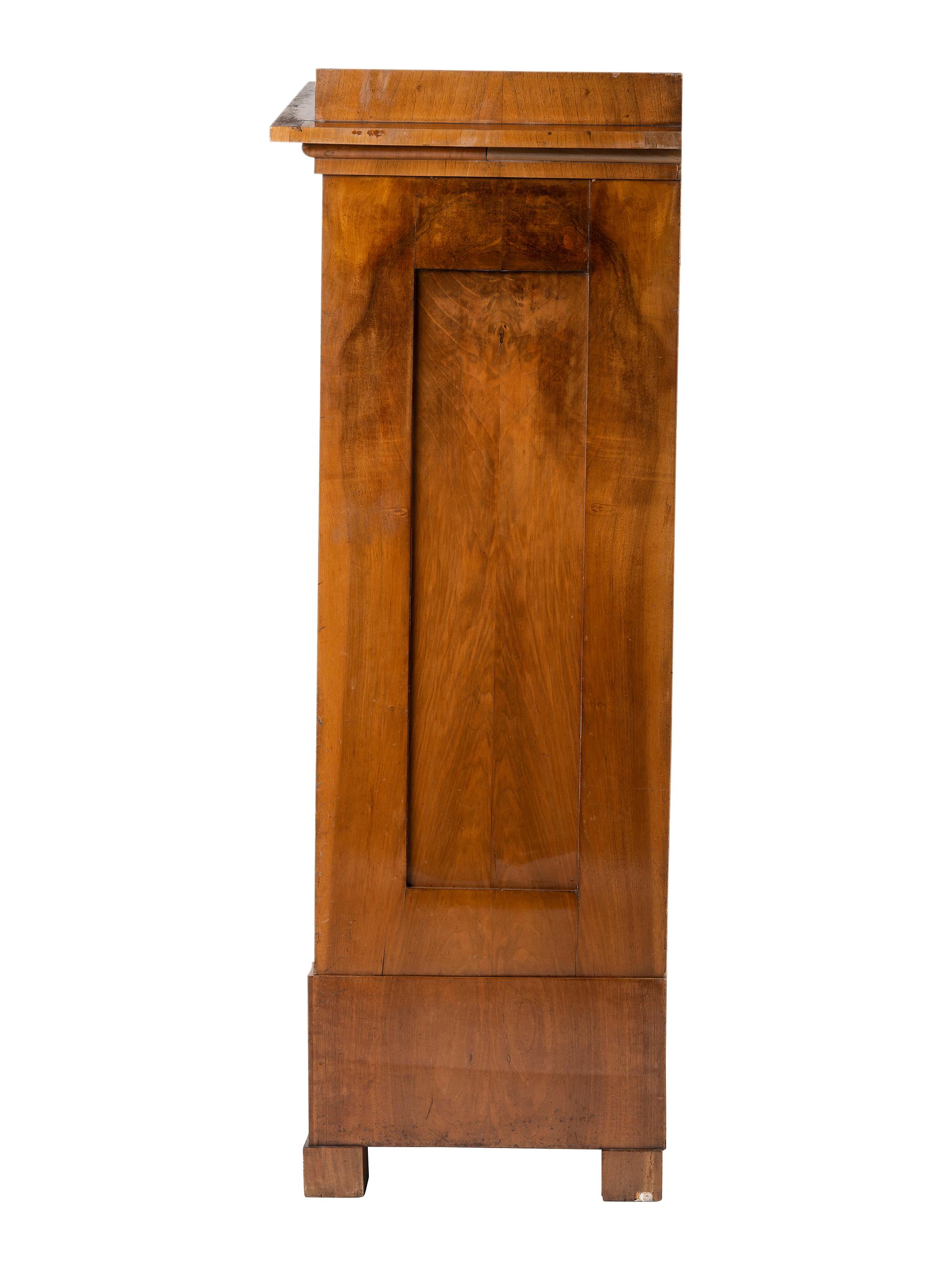A Biedermeier Figured Birch Cabinet