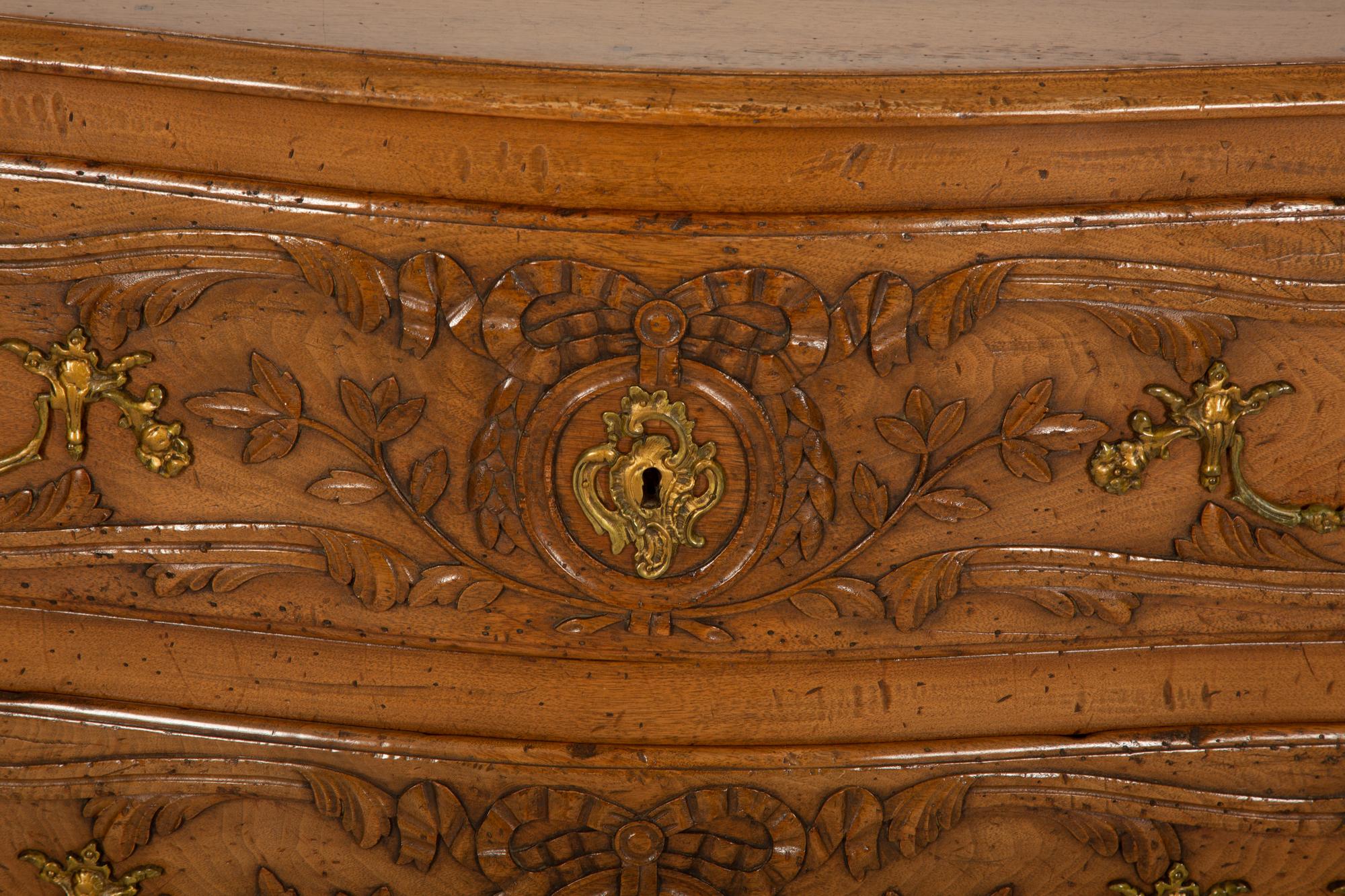 A French Provincial Carved Oak Commode