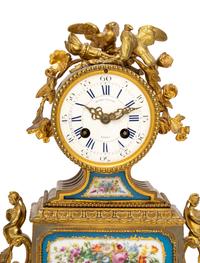 A French Gilt Metal and Porcelain Clock