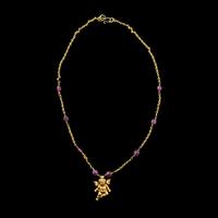 A Hellenistic Gold Eros Pendant — with a modern gold and pink spinel beads chain