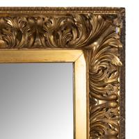 A Continental Baroque Style Carved Giltwood Mirror