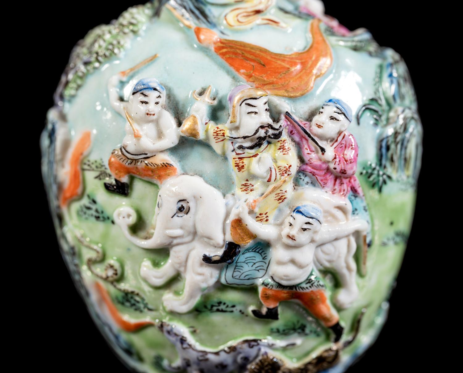 A Chinese Molded Famille Rose Porcelain Snuff Bottle