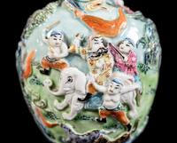 A Chinese Molded Famille Rose Porcelain Snuff Bottle