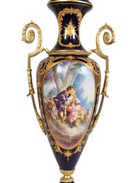 A Pair of Sèvres Style Gilt Metal Mounted Porcelain Covered Urns