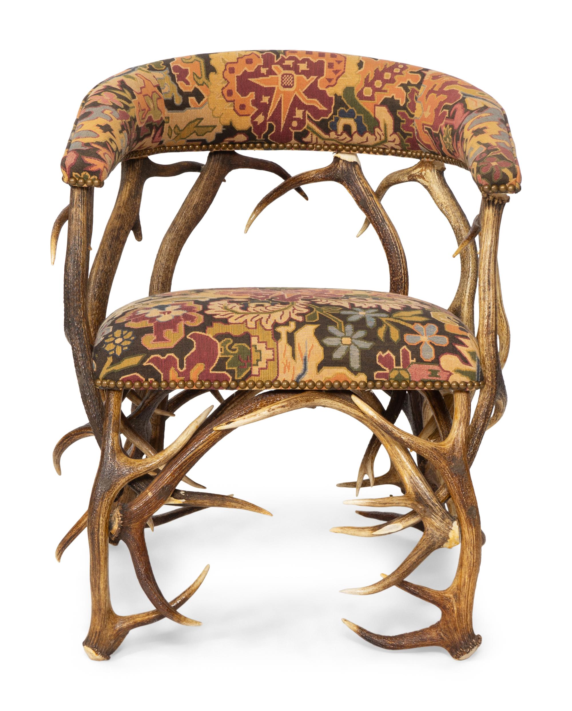 A Tapestry Upholstered Elk Antler Club Chair