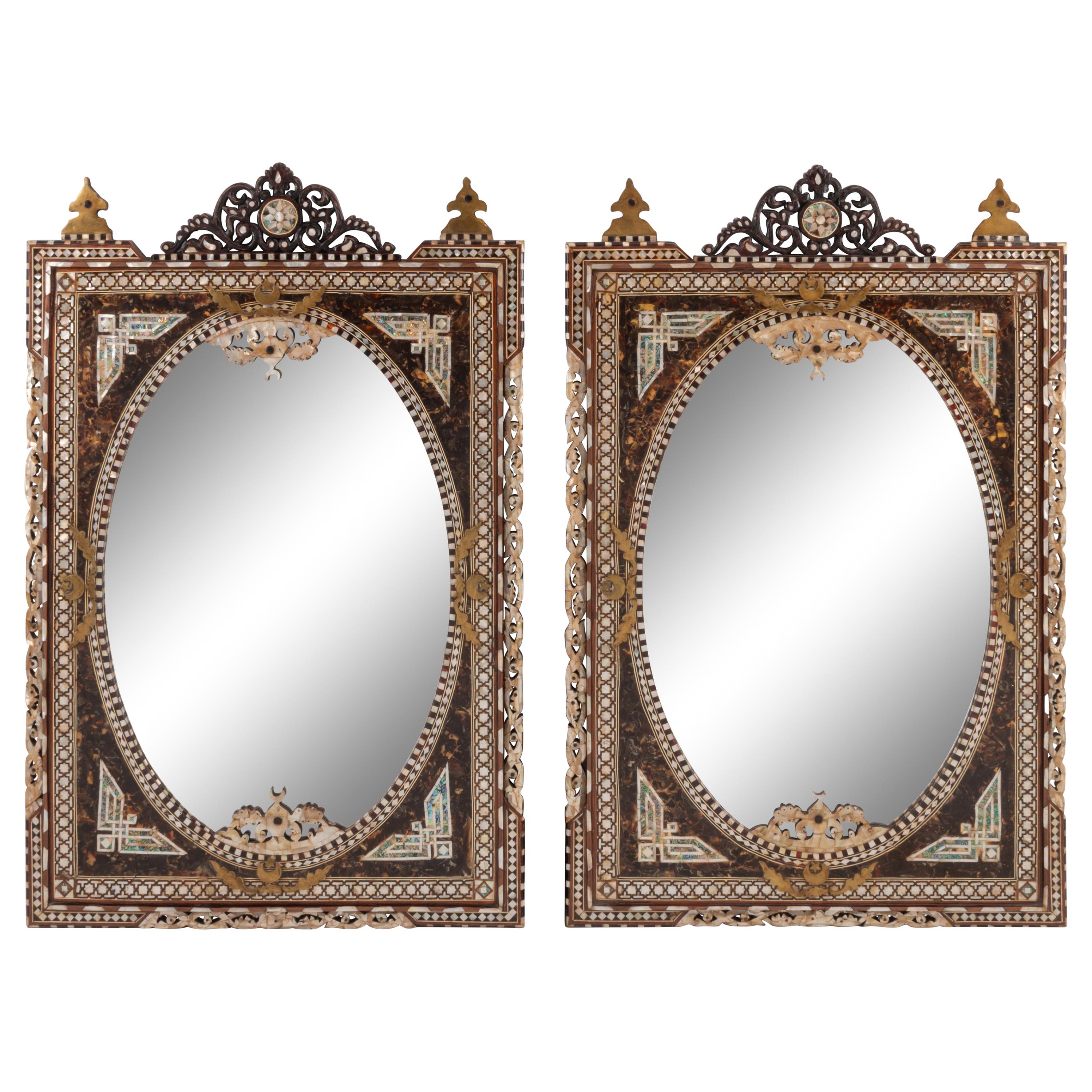 A Pair of Iberian Marquetry Oval Mirrors