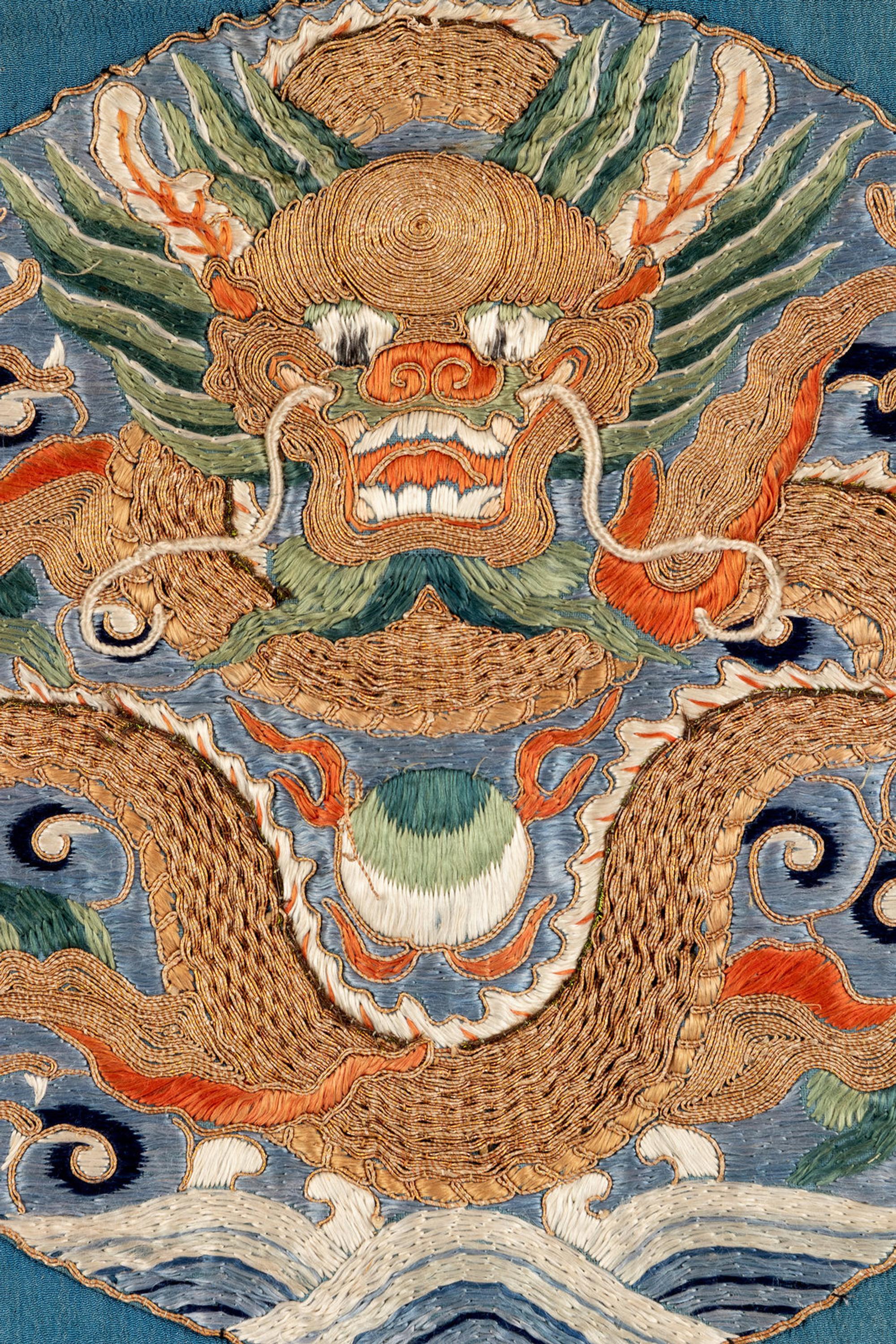 Two Chinese Blue Ground Silk Robes, Late Qing Dynasty 清晚期 藍地盤金繡游龍瑞獸纹道袍及藍地織錦女褂