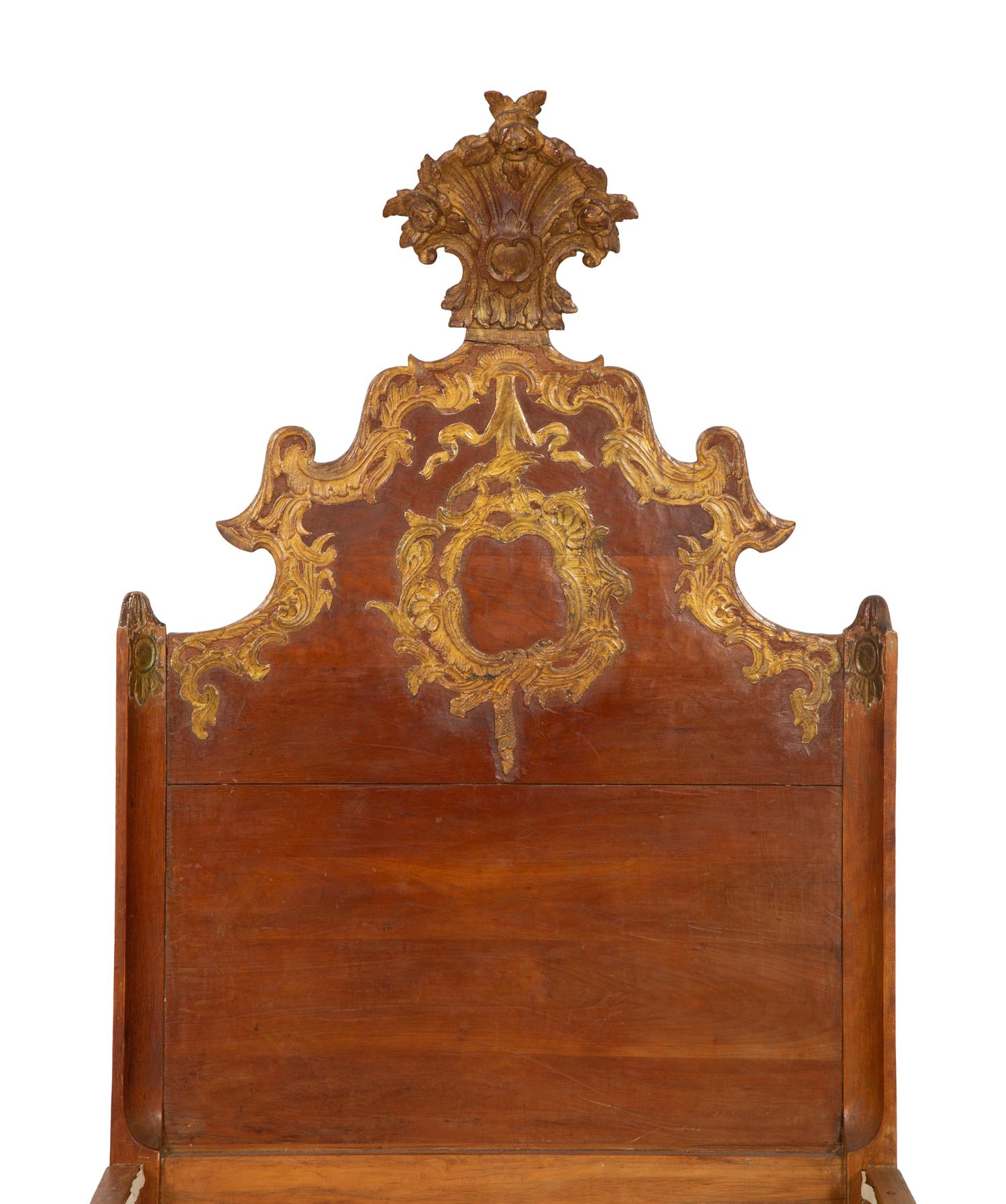 A Pair of Venetian Style Fruitwood and Parcel Gilt Twin Beds