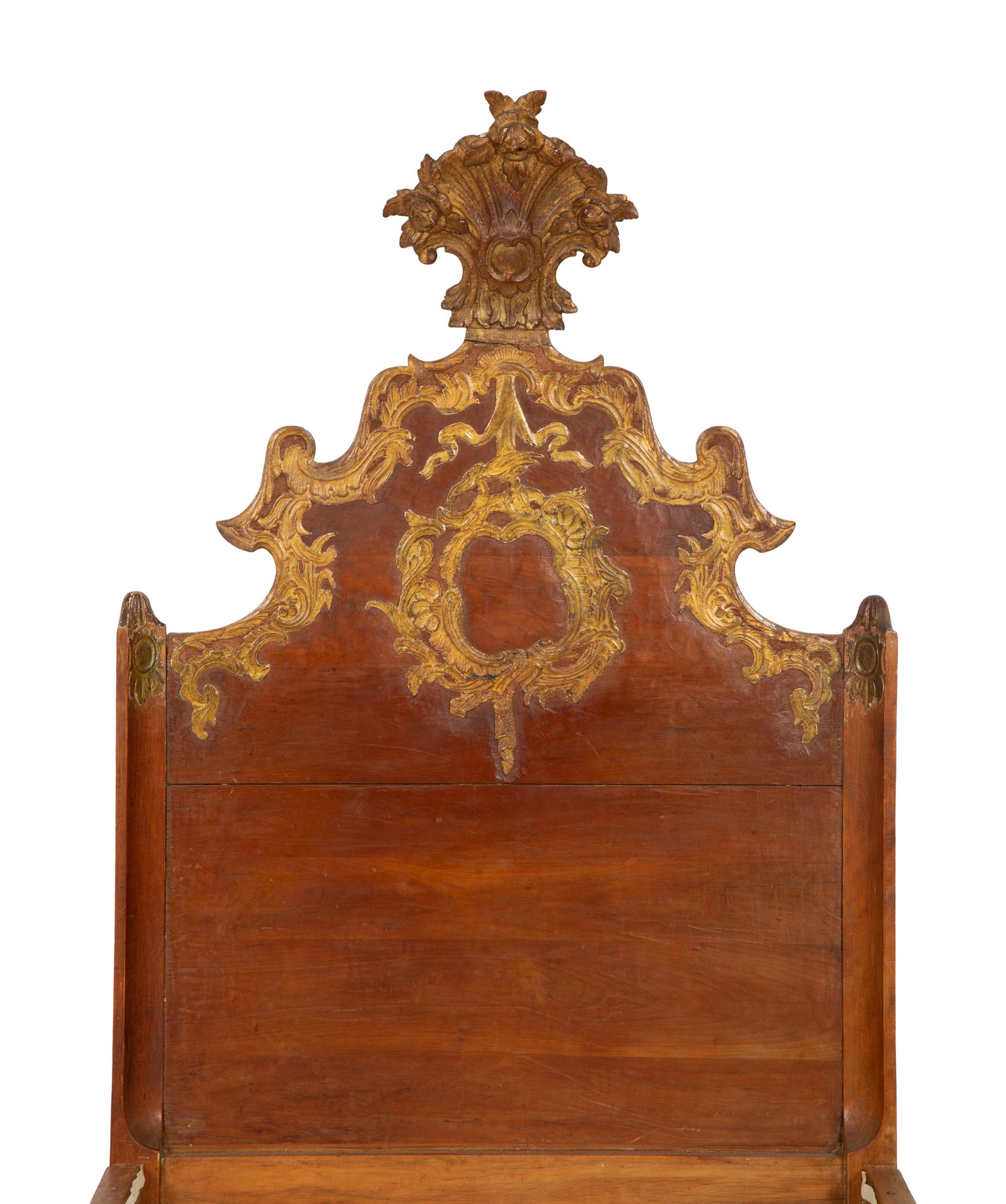 A Pair of Venetian Style Fruitwood and Parcel Gilt Twin Beds