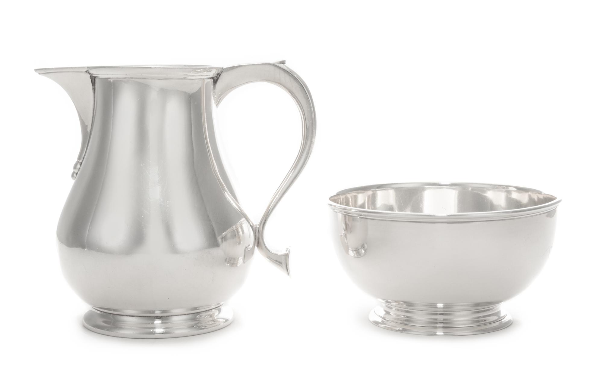 A George VI Silver Creamer and Sugar Bowl, Walter Wilson, London, 1947, each of plain baluster form on stepped bases.