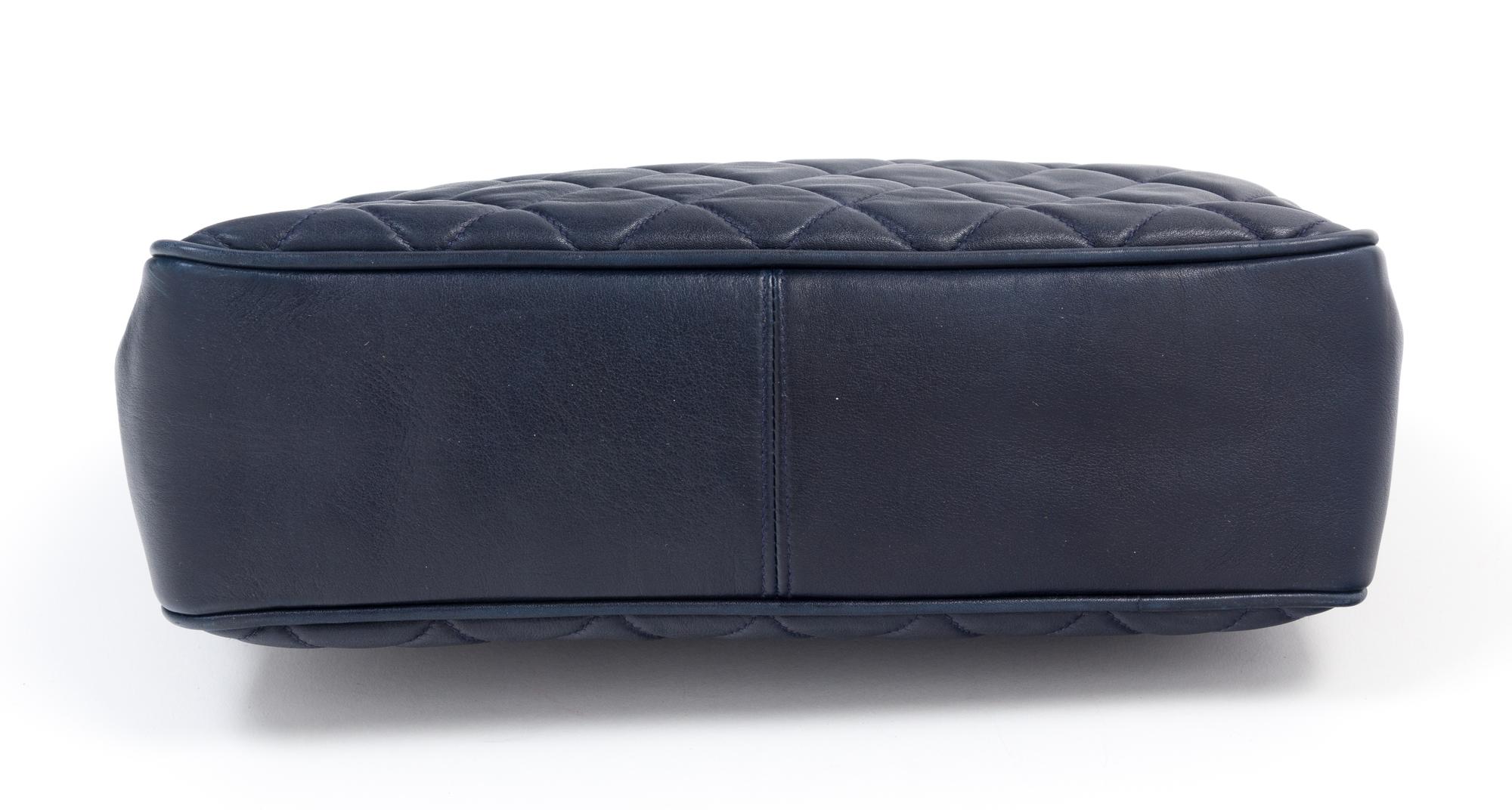 A Chanel Navy Quilted Leather Tote Handbag, 12" x 8" x 2"; Strap drop: 7".