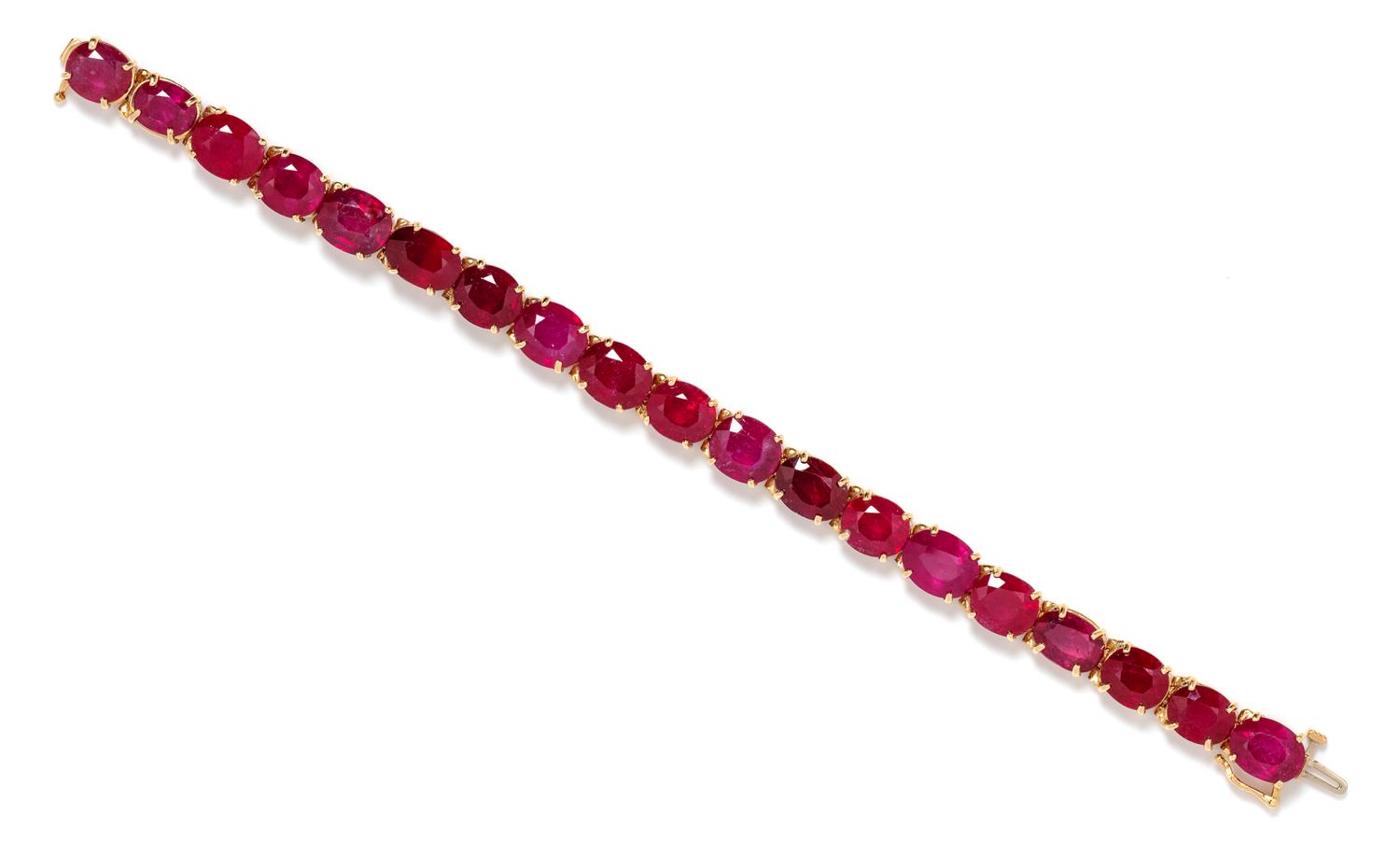 A 14 Karat Yellow Gold and Ruby Line Bracelet, 21.60 dwts.