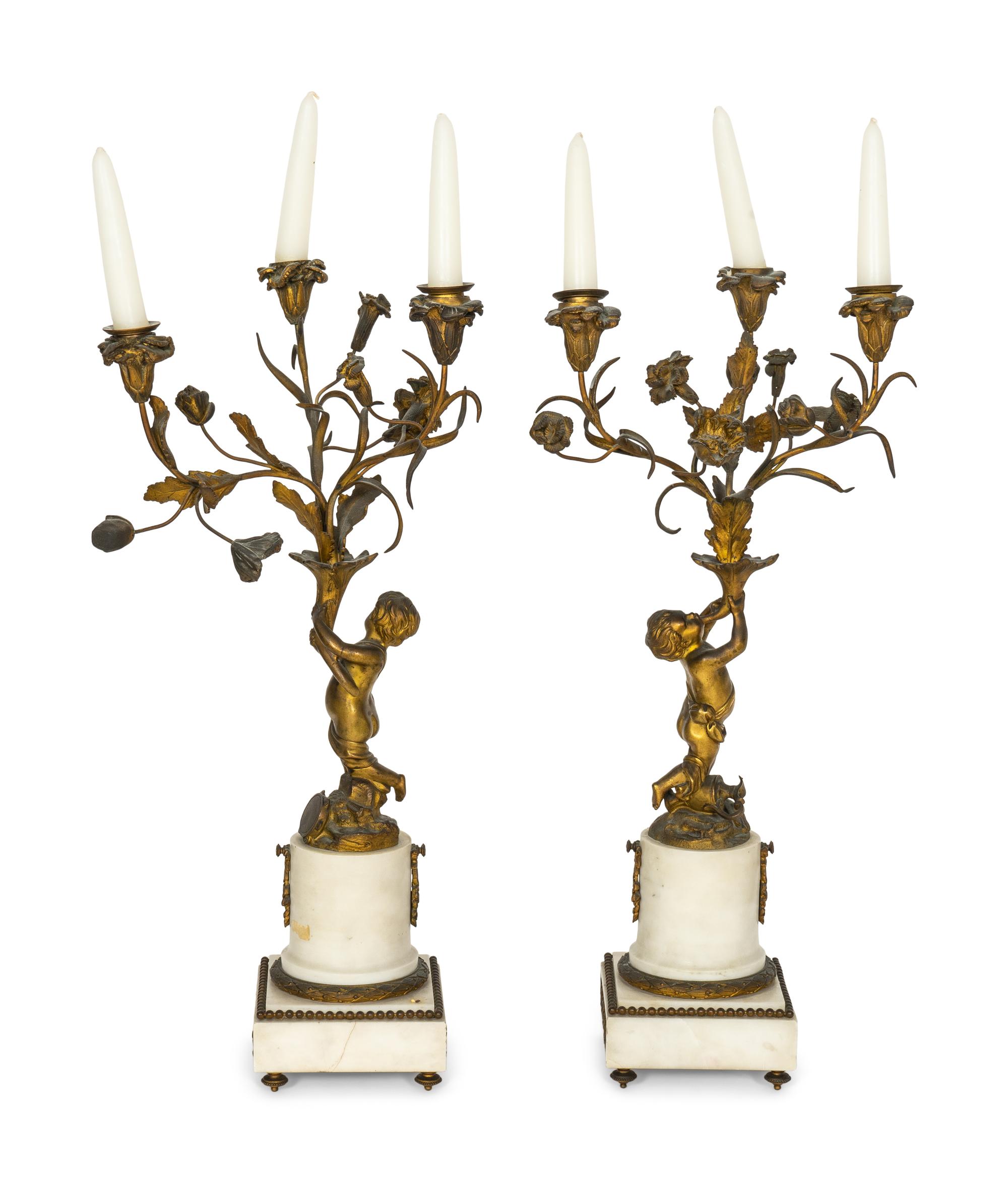 A Pair of French Gilt Bronze and Alabaster Three-Light Candelabra
