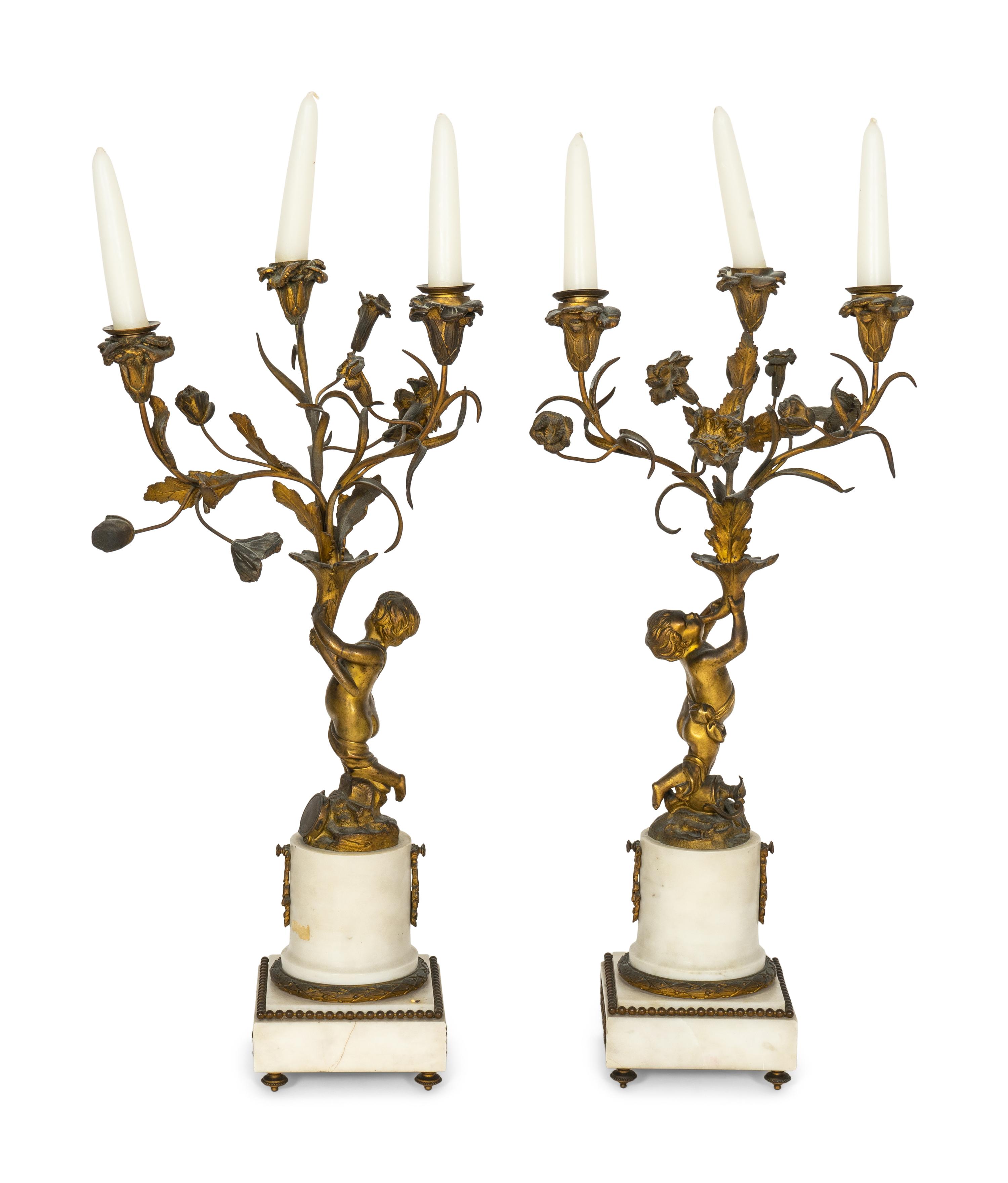 A Pair of French Gilt Bronze and Alabaster Three-Light Candelabra