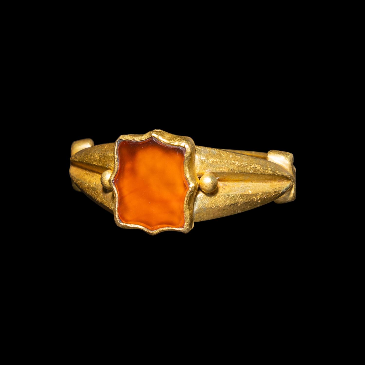 A Migration Period Gold and Spessartine Garnet Ring