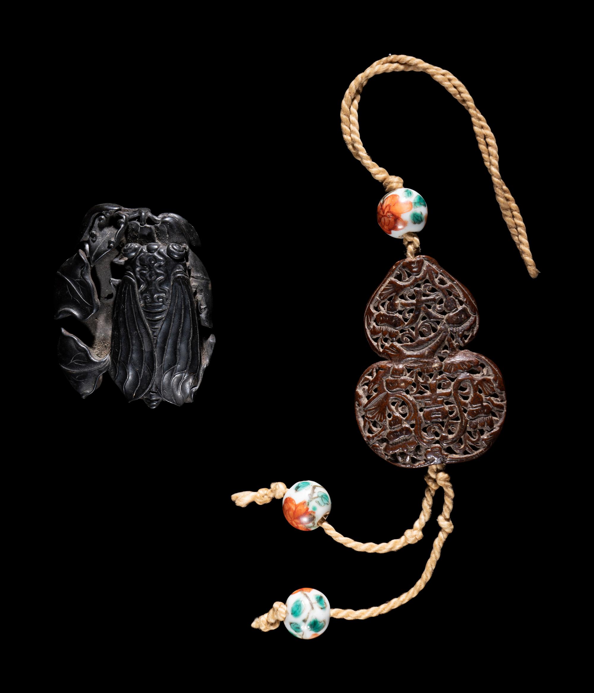 Two Chinese Carved Wood Pendants
