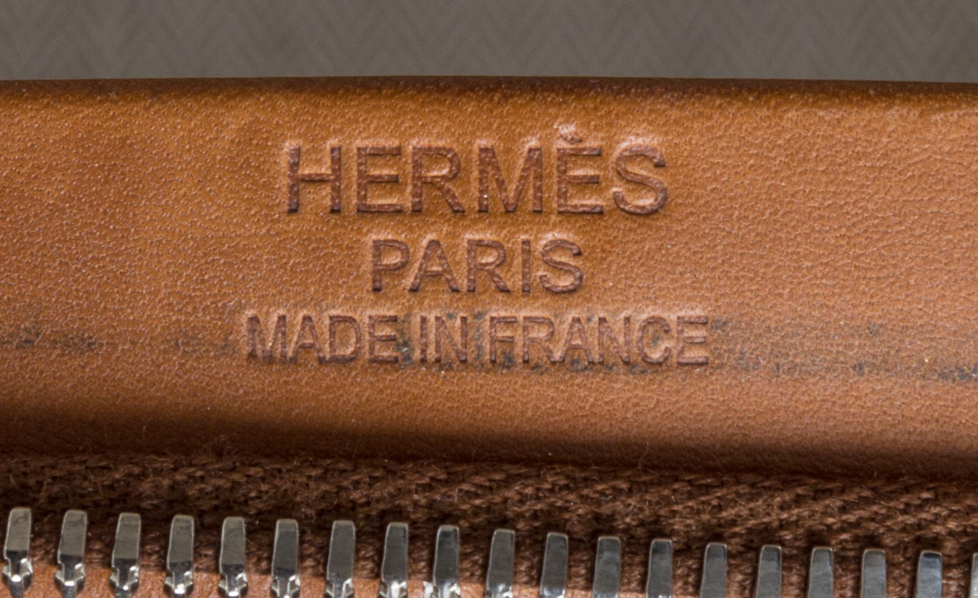 An Hermes Ecru Canvas and Fawn Barenia Calfskin Caleche-Express Suitcase, 14" x 21.5" x 10".