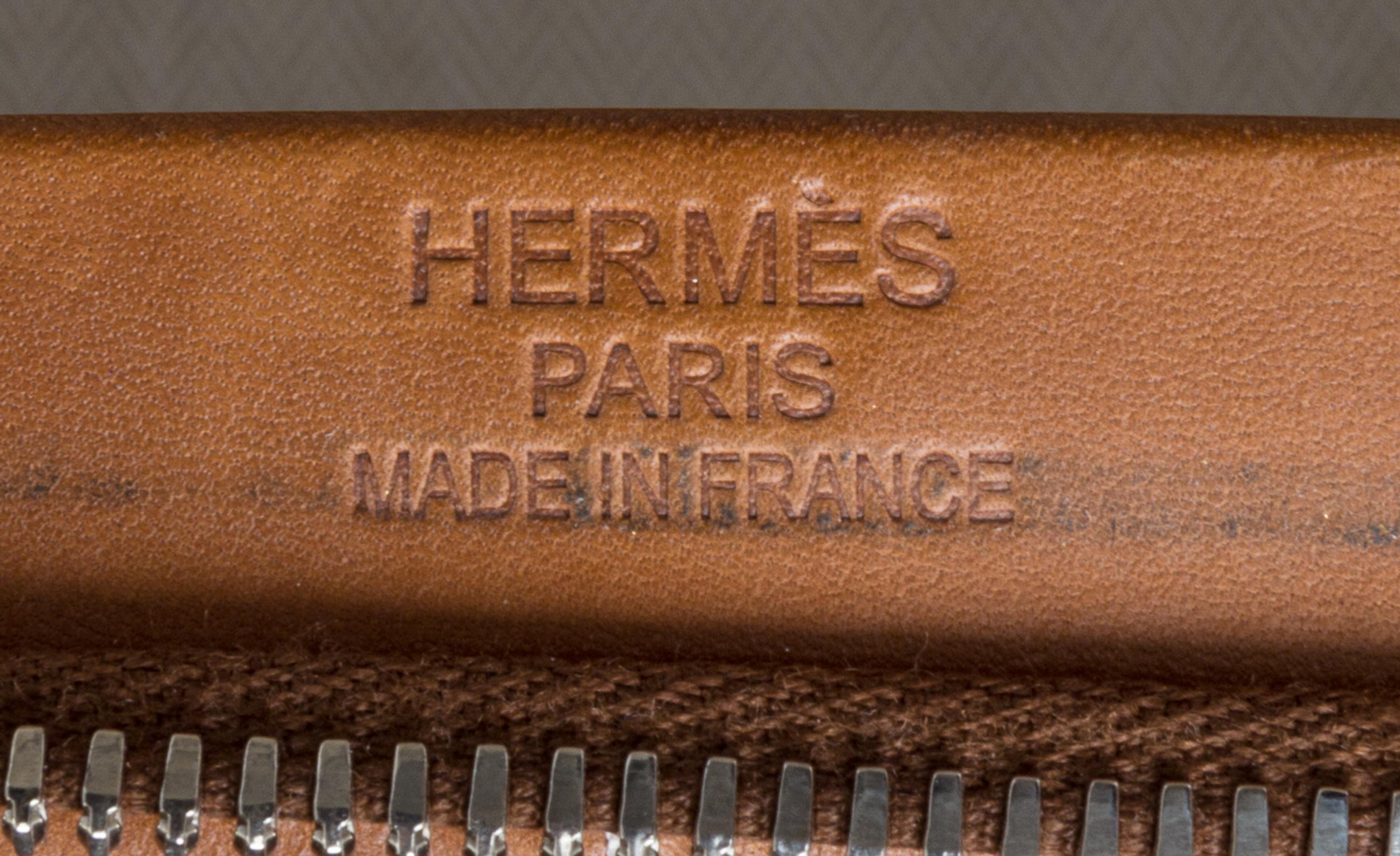 An Hermes Ecru Canvas and Fawn Barenia Calfskin Caleche-Express Suitcase, 14" x 21.5" x 10".