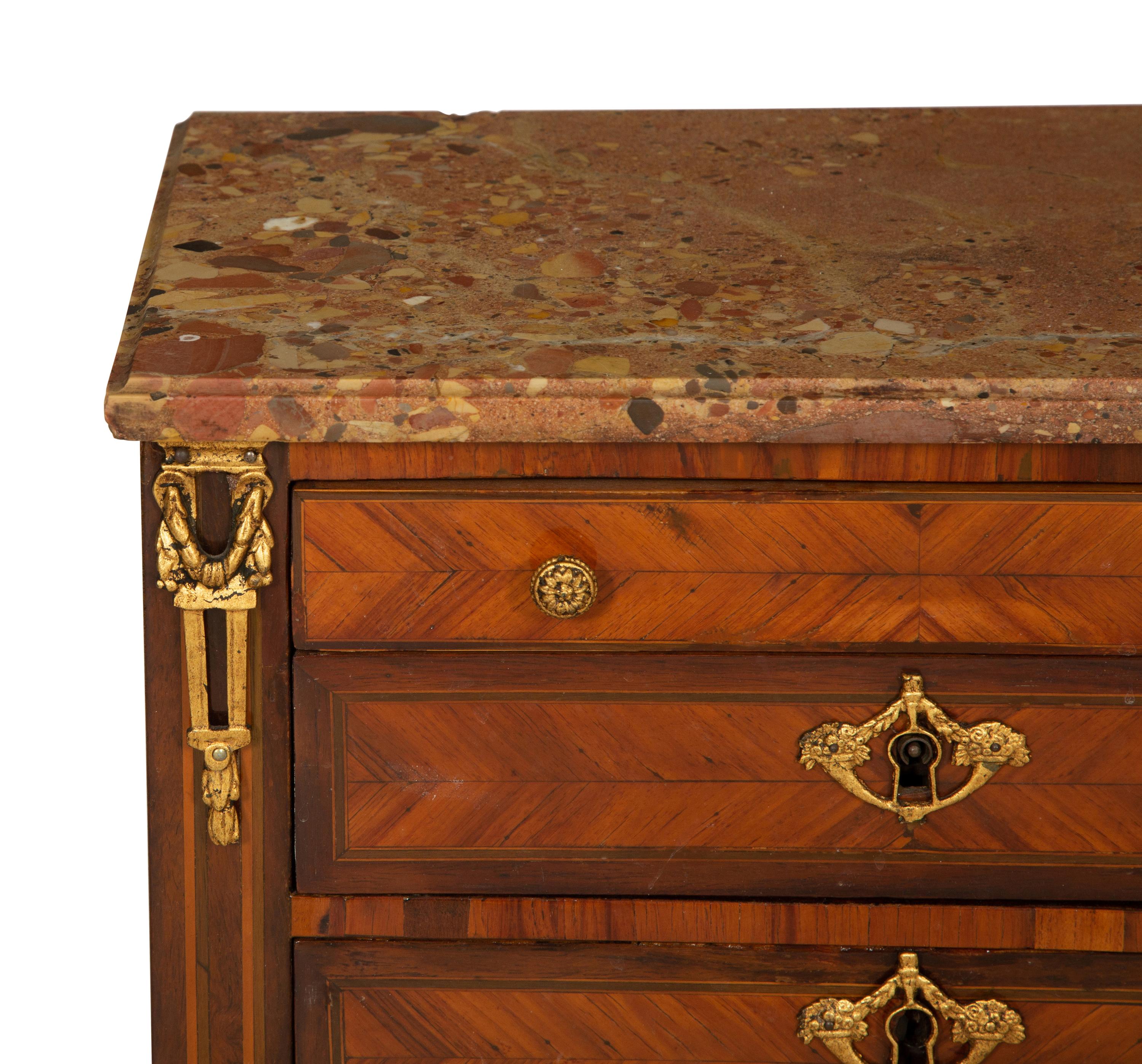 A Louis XVI Diminutive Marble-Top Four Drawer Chiffonier