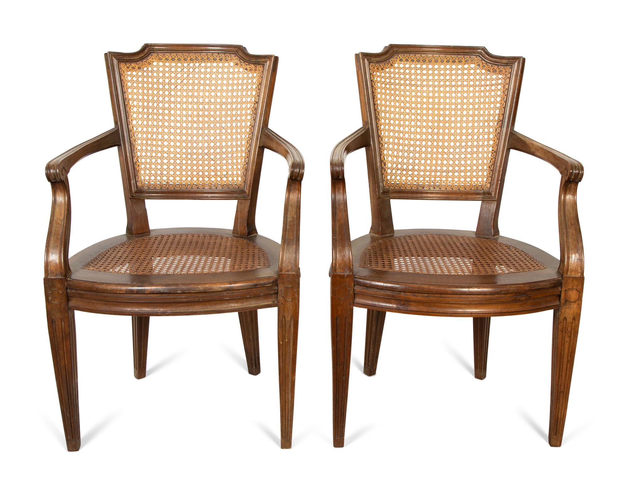 A Pair of Italian Caned Armchairs